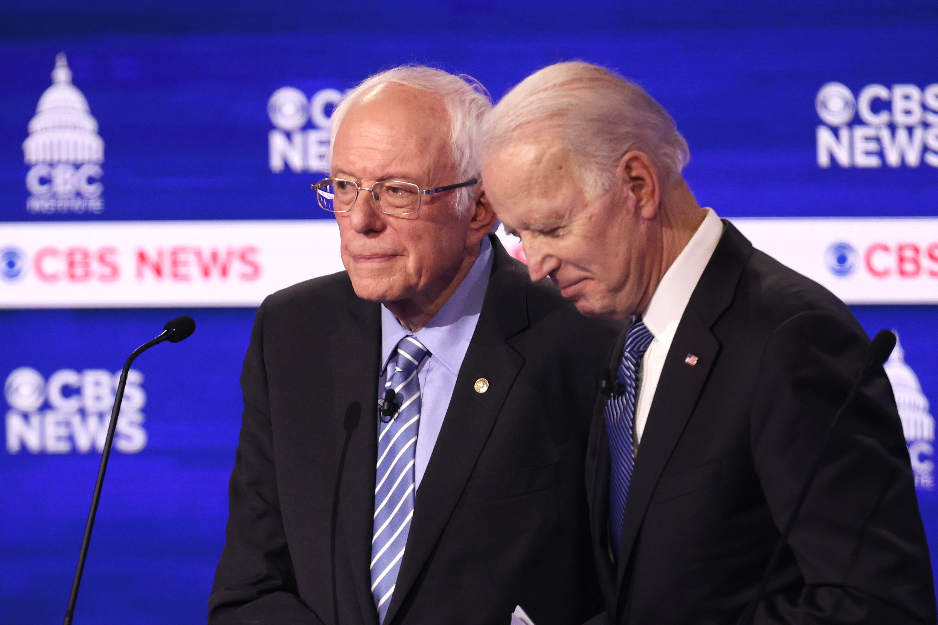 CHARLESTON, SOUTH CAROLINA - FEBRUARY 25: Democratic presidential candidates Sen. Bernie Sanders (I-VT) and former Vice President Joe Biden speak during a break at the Democratic presidential primary debate at the Charleston Gaillard Center on February 25, 2020 in Charleston, South Carolina. Seven candidates qualified for the debate, hosted by CBS News and Congressional Black Caucus Institute, ahead of South Carolina’s primary in four days. (Photo by Win McNamee/Getty Images)