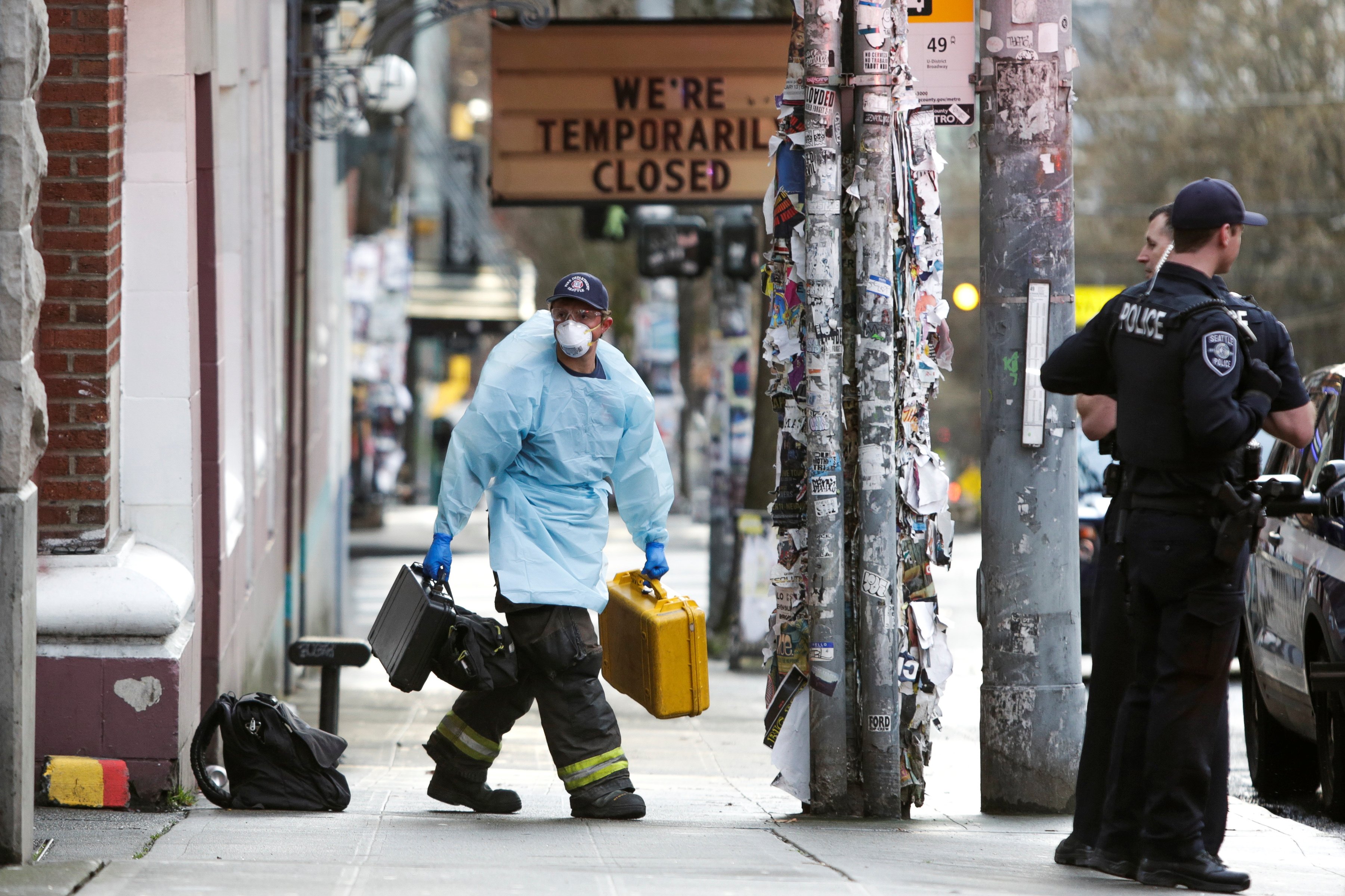 A member of the Seattle Fire Department wears personal protective equipment (PPE) following a medical response as efforts continue to help slow the spread of coronavirus disease (COVID-19) in Seattle, Washington, U.S. March 31, 2020. REUTERS/Jason Redmond 