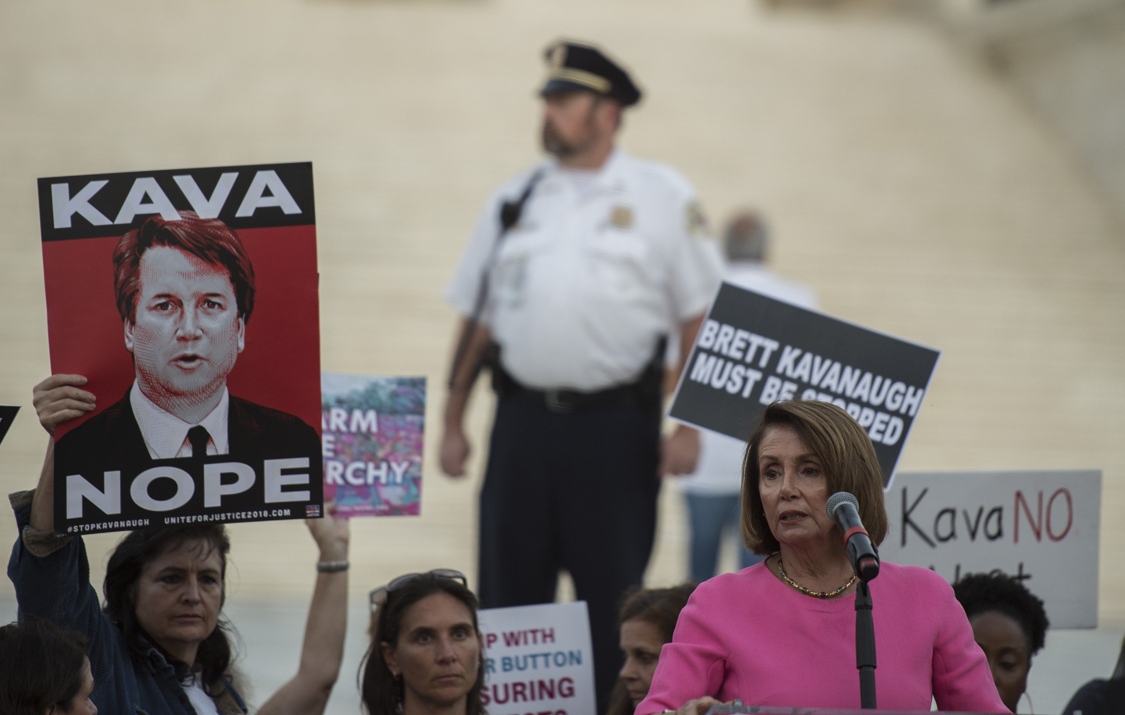US House Minority leader Nancy Pelosi speaks to activists during a protest against US Supreme Court nominee Brett Kavanaugh in Washington, DC, on October 3, 2018. (Photo by ANDREW CABALLERO-REYNOLDS / AFP) (Photo credit should read ANDREW CABALLERO-REYNOLDS/AFP via Getty Images)