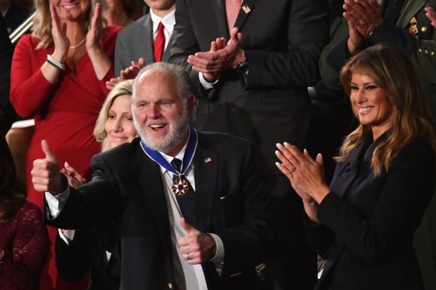 Radio personality Rush Limbaugh pumps thumb after being awarded the Medal of Freedom by First Lady Melania Trump after being acknowledged by US President Donald Trump as he delivers the State of the Union address at the US Capitol in Washington, DC, on February 4, 2020. (MANDEL NGAN/AFP via Getty Images)
