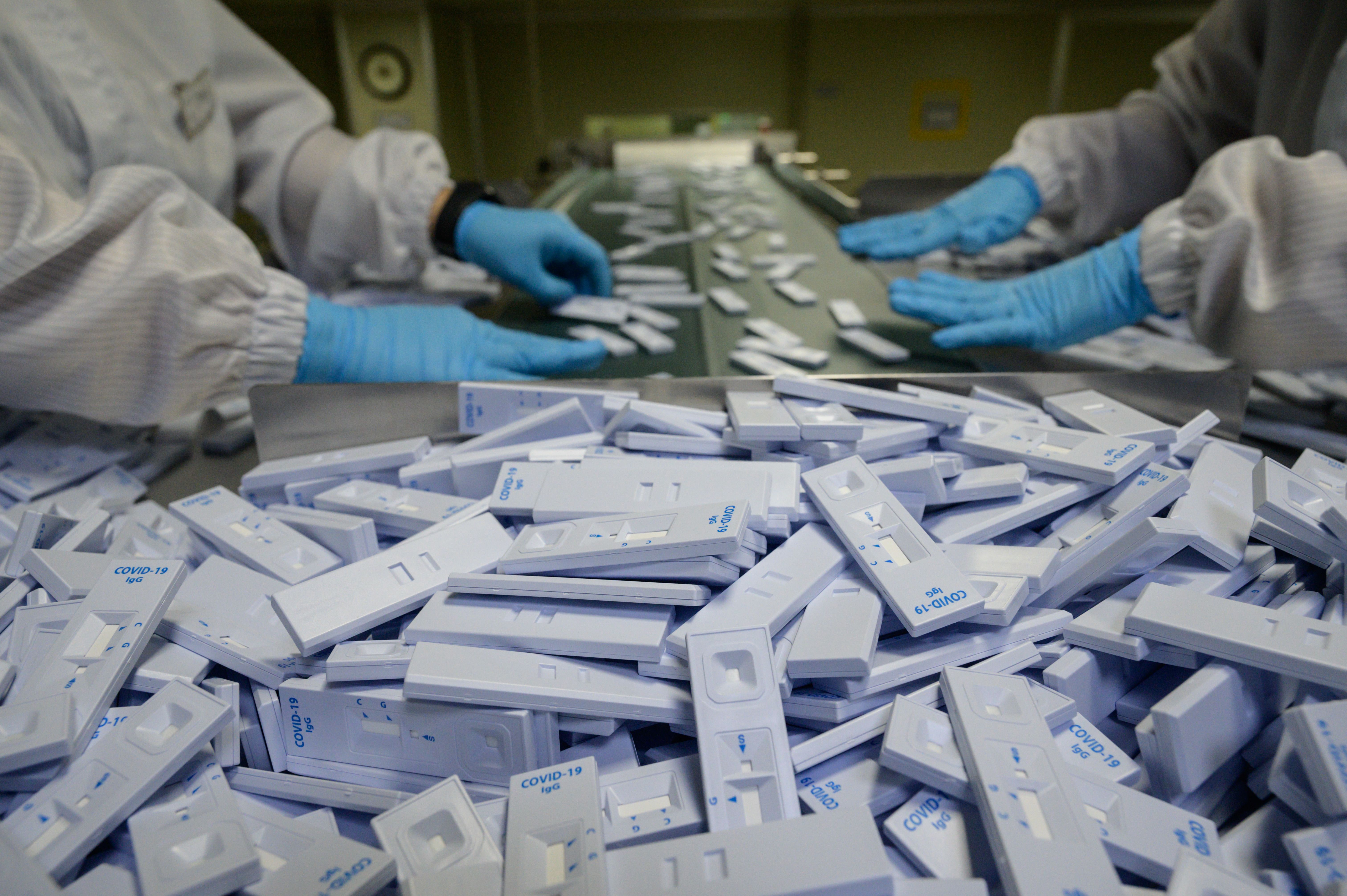 Sample testing devices used in diagnosing the COVID-19 novel coronavirus. (Photo by ED JONES/AFP via Getty Images)