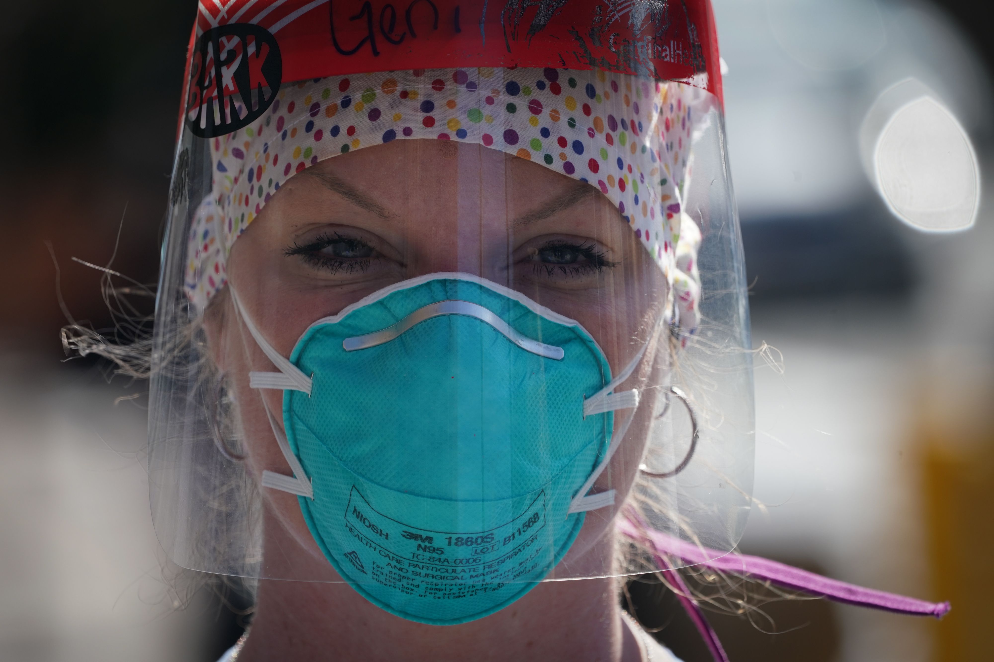 A member of the medical staff listens as Montefiore Medical Center nurses call for N95 masks and other critical PPE to handle the coronavirus (COVID-19) pandemic on April 1, 2020 in New York. (BRYAN R. SMITH/AFP via Getty Images)