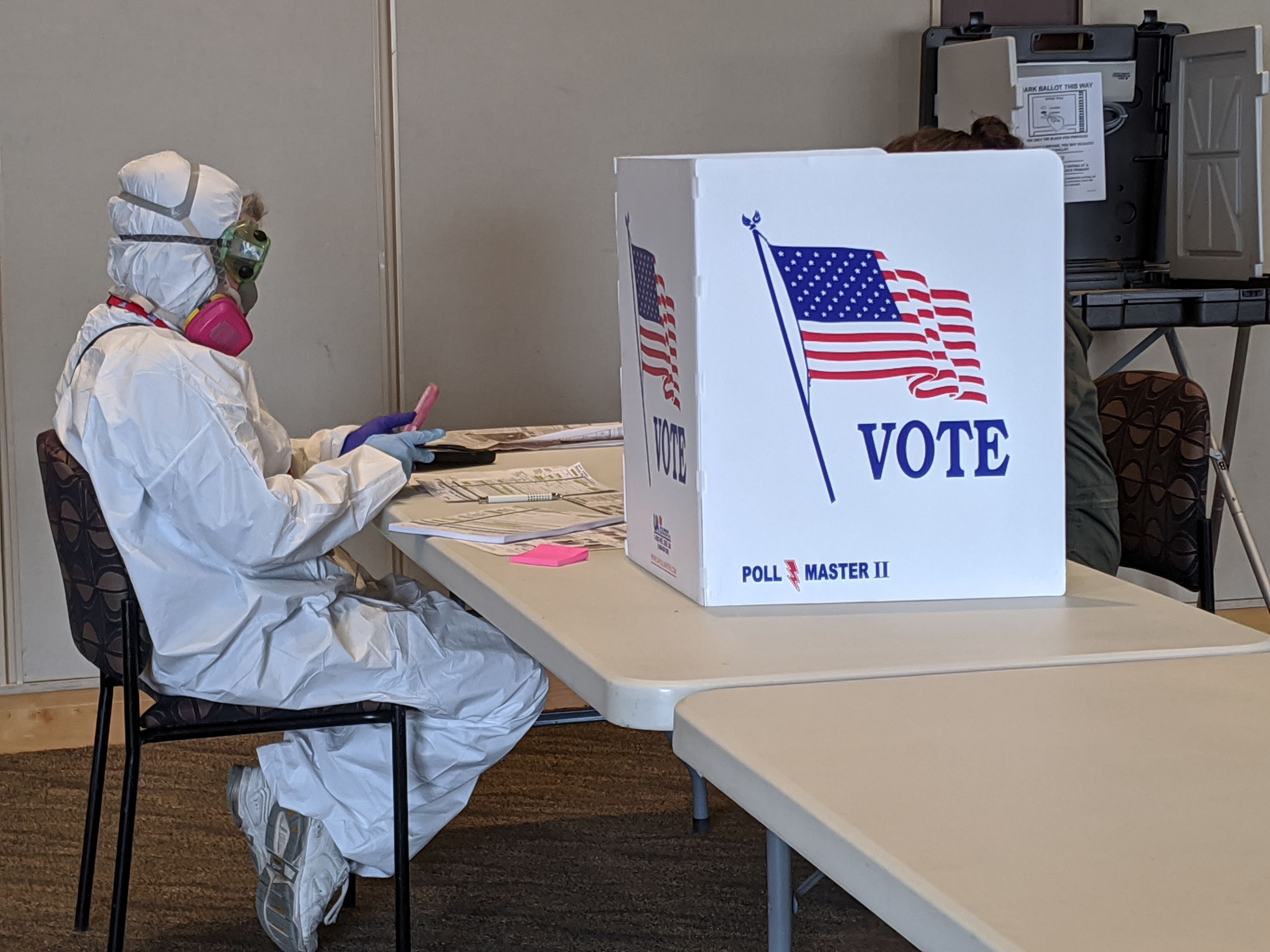 Elections Chief Inspector Mary Magdalen Moser runs a polling location in Kenosha, Wisconsin, in full hazmat gear. (DEREK R. HENKLE/AFP via Getty Images)