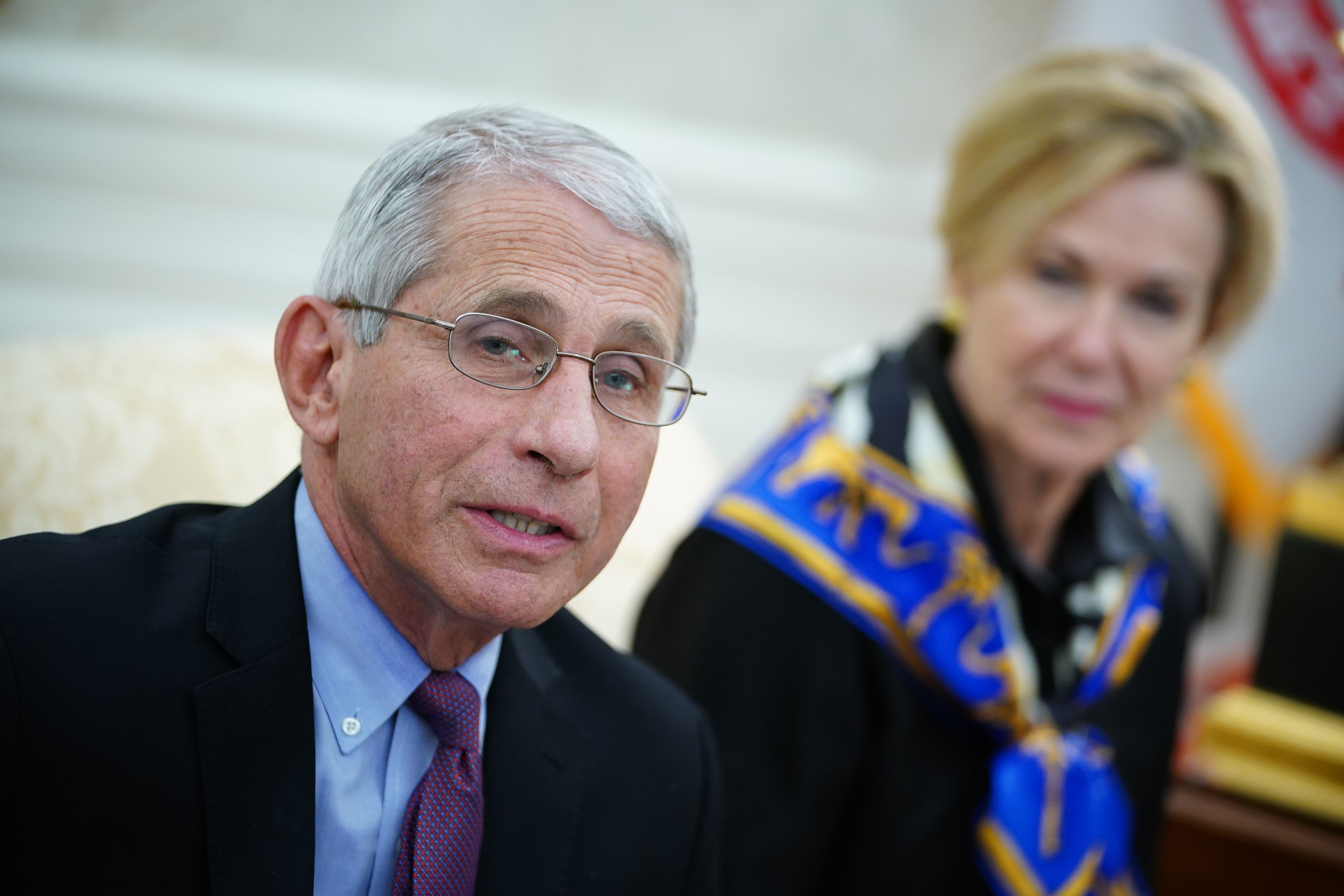 Dr. Anthony Fauci (L), director of the National Institute of Allergy and Infectious Diseases speaks as US President Donald Trump meets with Louisiana Governor John Bel Edwards(D-LA) in the Oval Office of the White House in Washington, DC on April 29, 2020. (Photo by MANDEL NGAN/AFP via Getty Images)