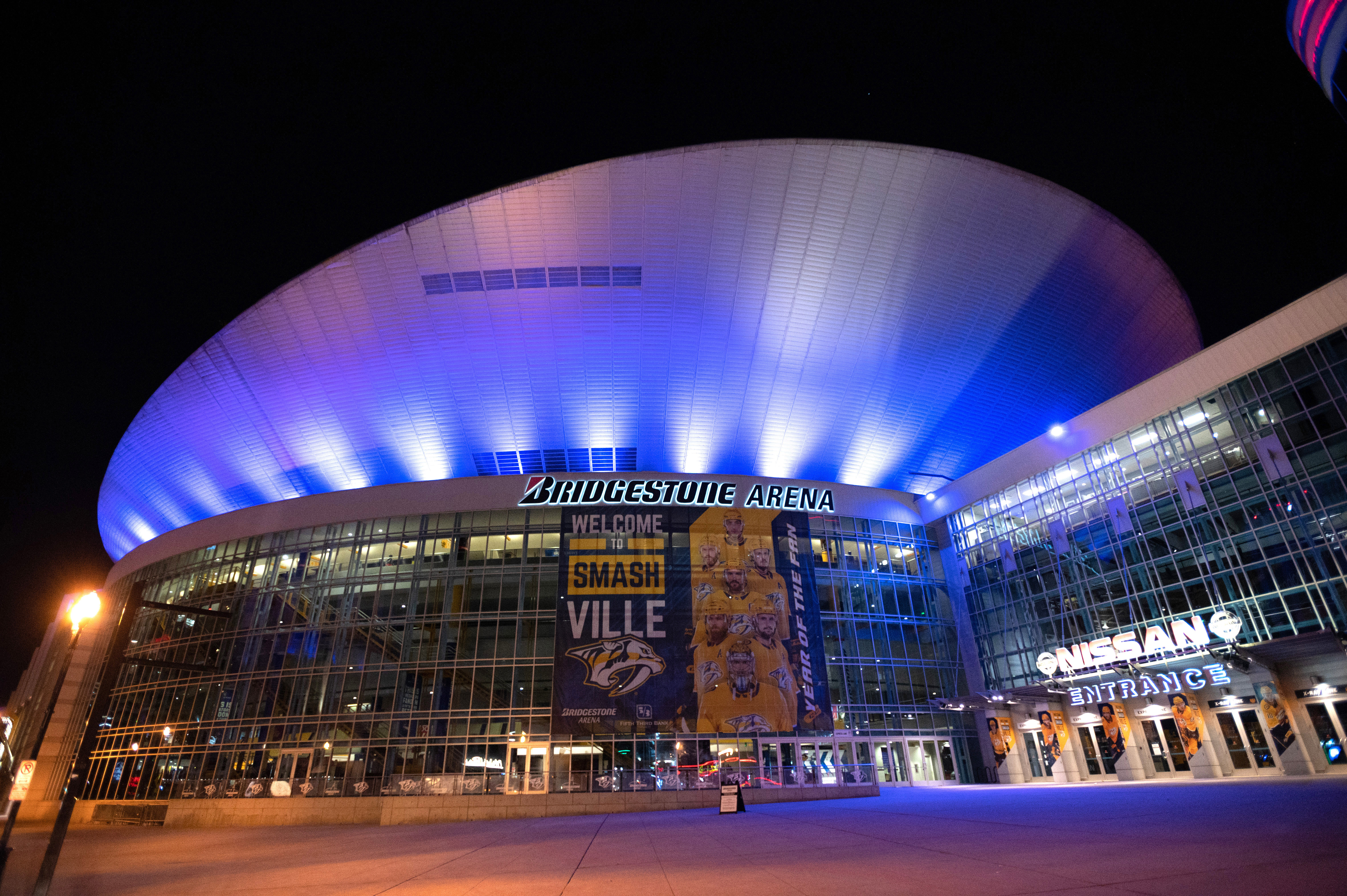 NASHVILLE, TN - APRIL 09: Bridgestone Arena is bathed in blue light on April 09, 2020 in Nashville, Tennessee. Landmarks and buildings across the nation are displaying blue lights to show support for health care workers and first responders on the front lines of the COVID-19 pandemic. (Photo by Jason Kempin/Getty Images)
