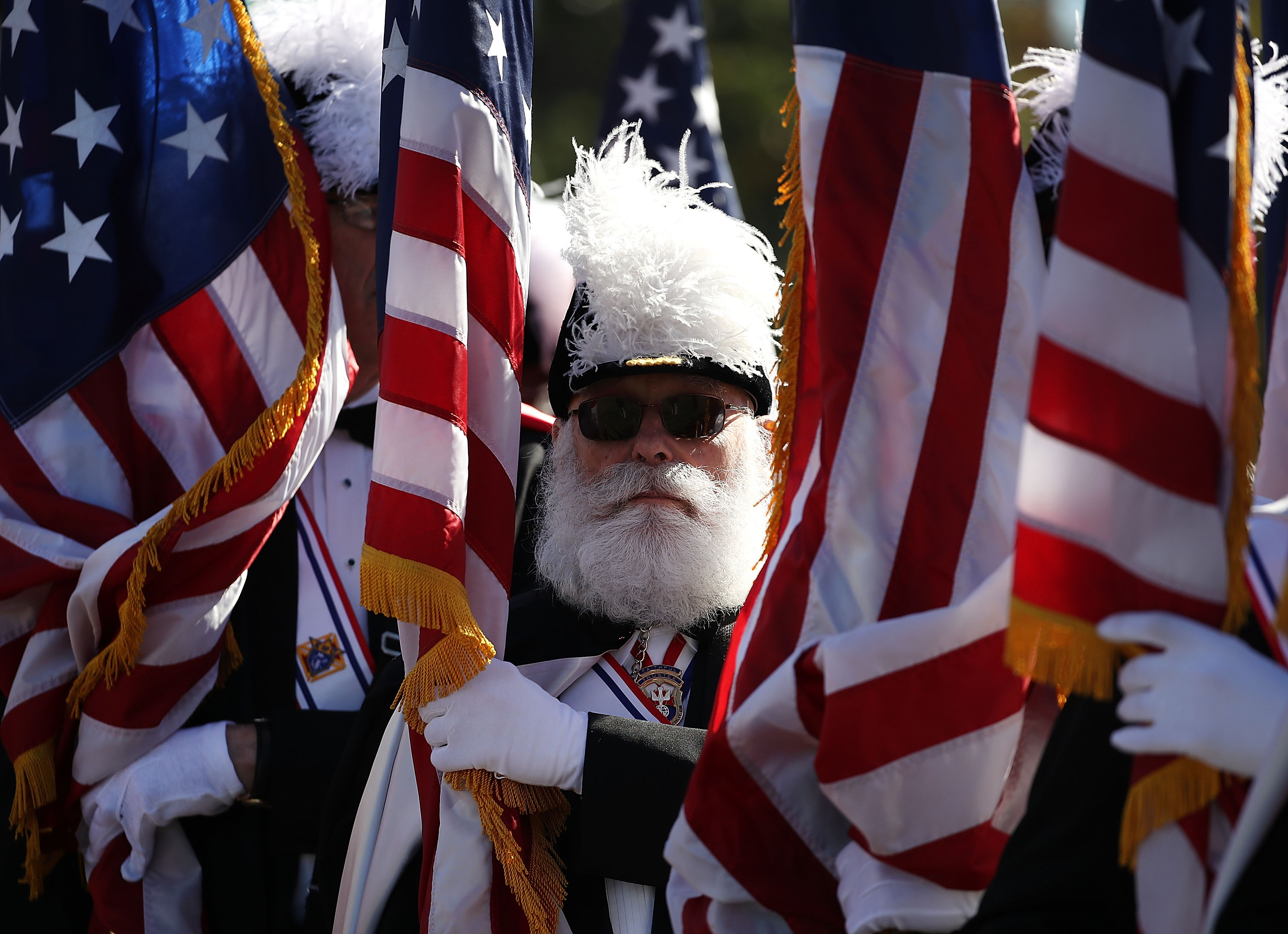 WASHINGTON, DC - OCTOBER 10: Knights of Columbus member, Dick Bissel holds an Amerian flag during a Columbus Day ceremony at the National Columbus Memorial in front of Union Station, October 10, 2016 in Washington, DC. Columbus Day celebrates Christopher Columbus' arrival in the Americas on October 12, 1492. (Photo by Mark Wilson/Getty Images)