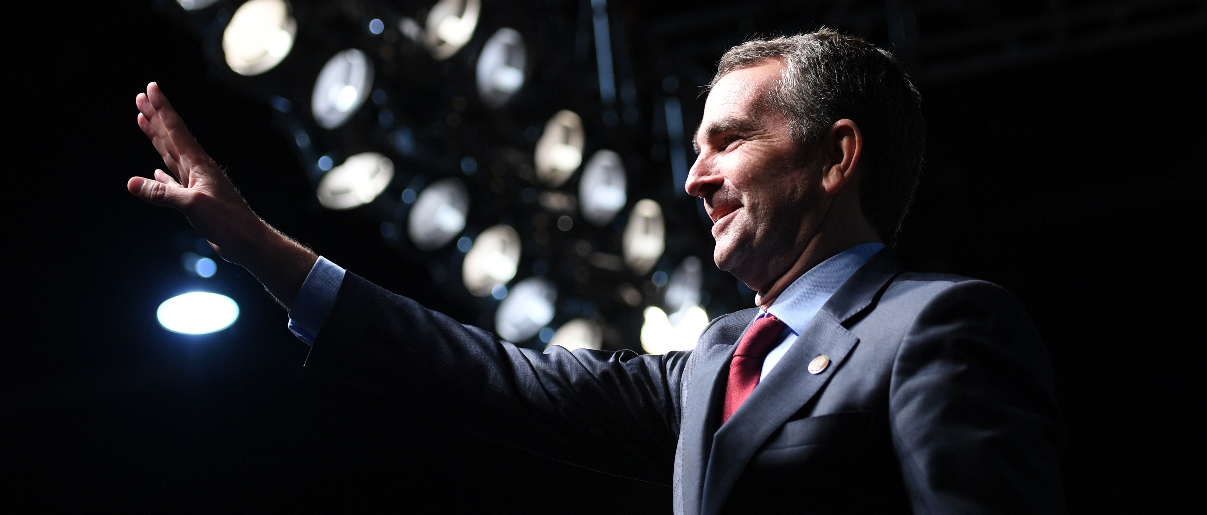 Democratic Gubernatorial Candidate Ralph Northam waves as he arrives to speak during a campaign rally in Richmond, Virginia on October 19, 2017. / AFP PHOTO / JIM WATSON (Photo credit should read JIM WATSON/AFP via Getty Images)