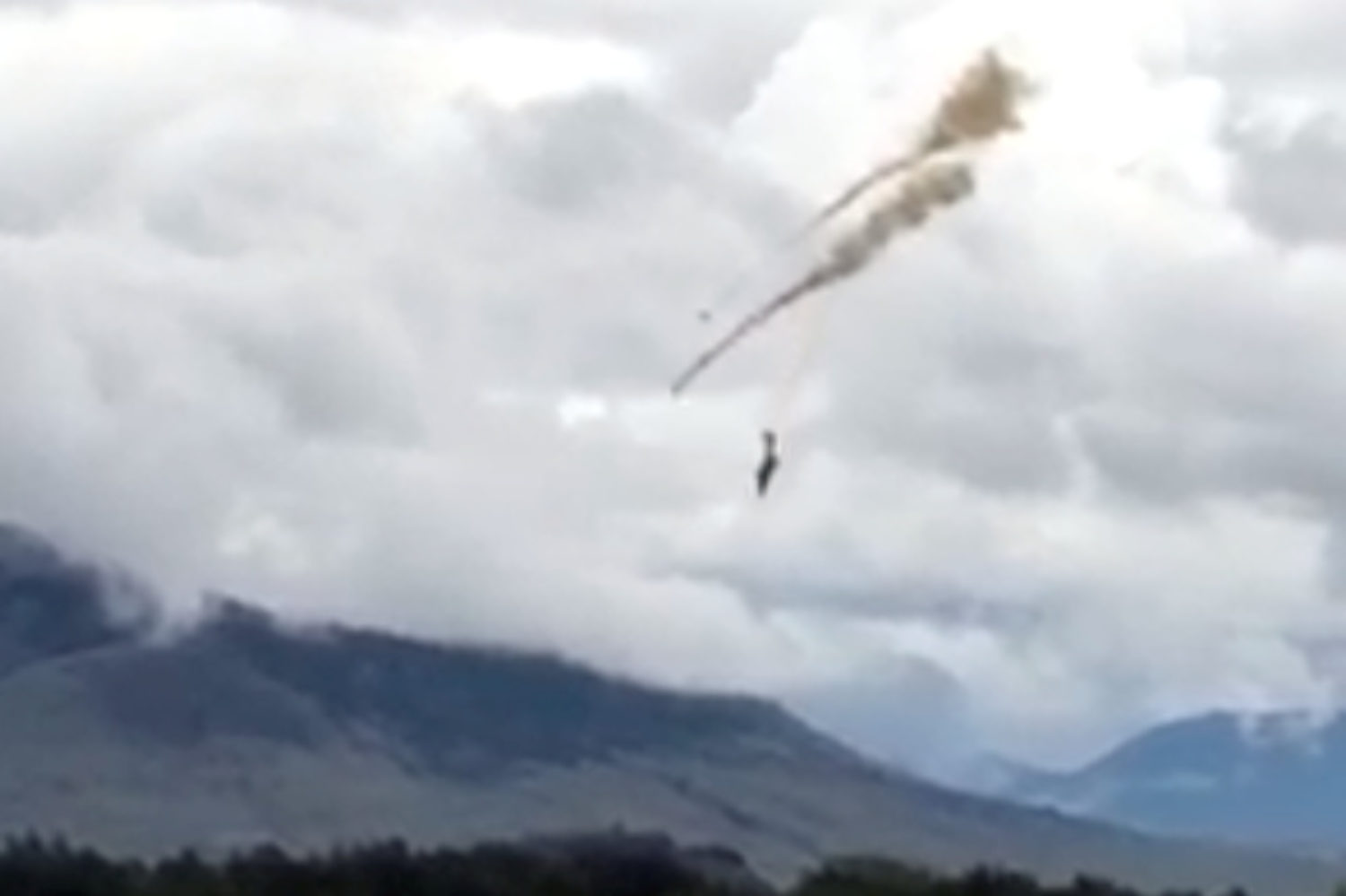 A plane of the Royal Canadian Air Force's Snowbirds aerobatic demonstration team is seen prior crashing in Kamloops, British Columbia, Canada May 17, 2020, in this still image obtained from a social media video. Shannon Forrest/via REUTERS