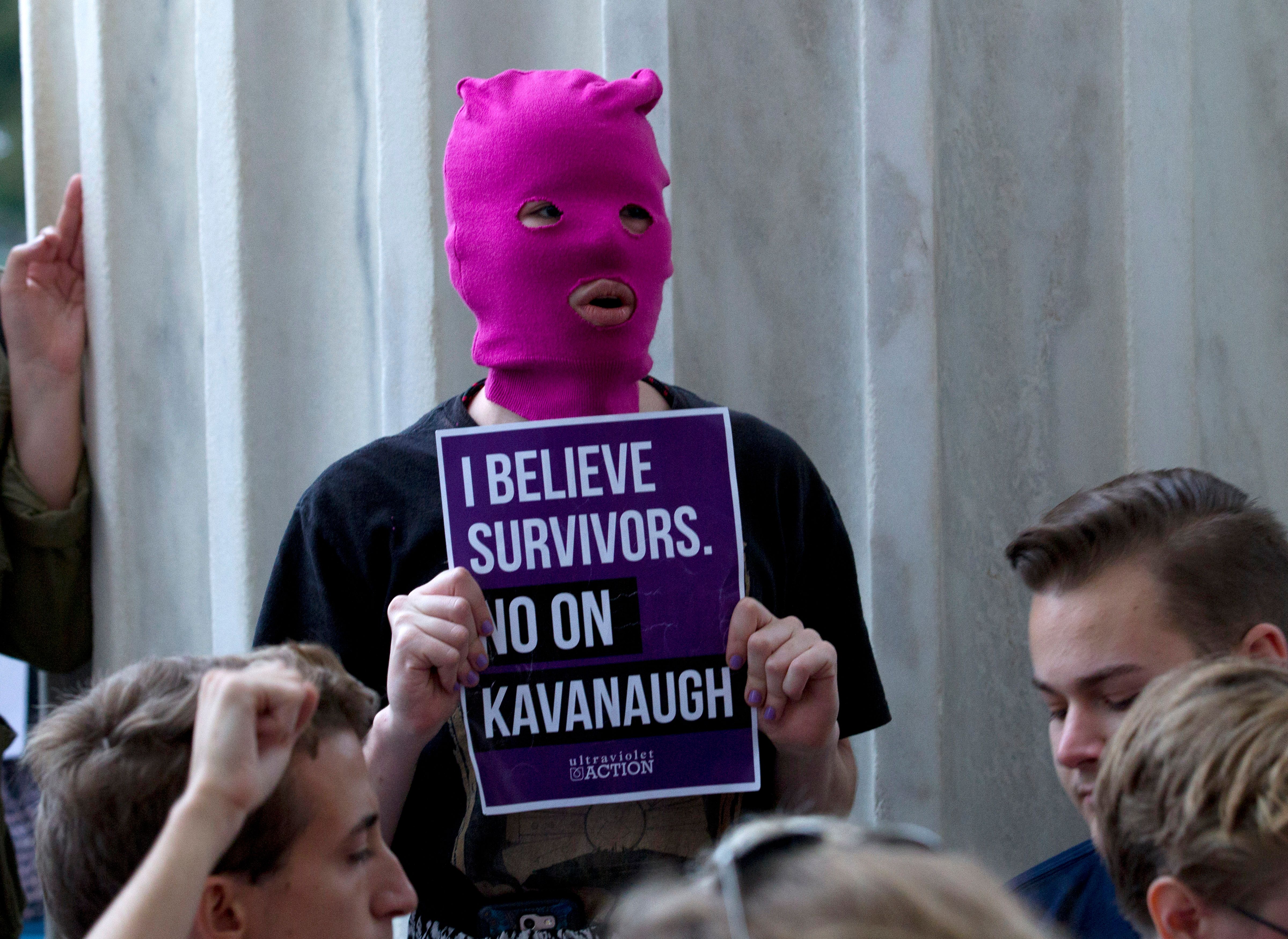 Demonstrators take the steps of the US Supreme Court to protest against the appointment of Supreme Court nominee Brett Kavanaugh in Washington DC, on October 6, 2018. (Photo by Jose Luis Magana / AFP) (Photo credit should read JOSE LUIS MAGANA/AFP via Getty Images)