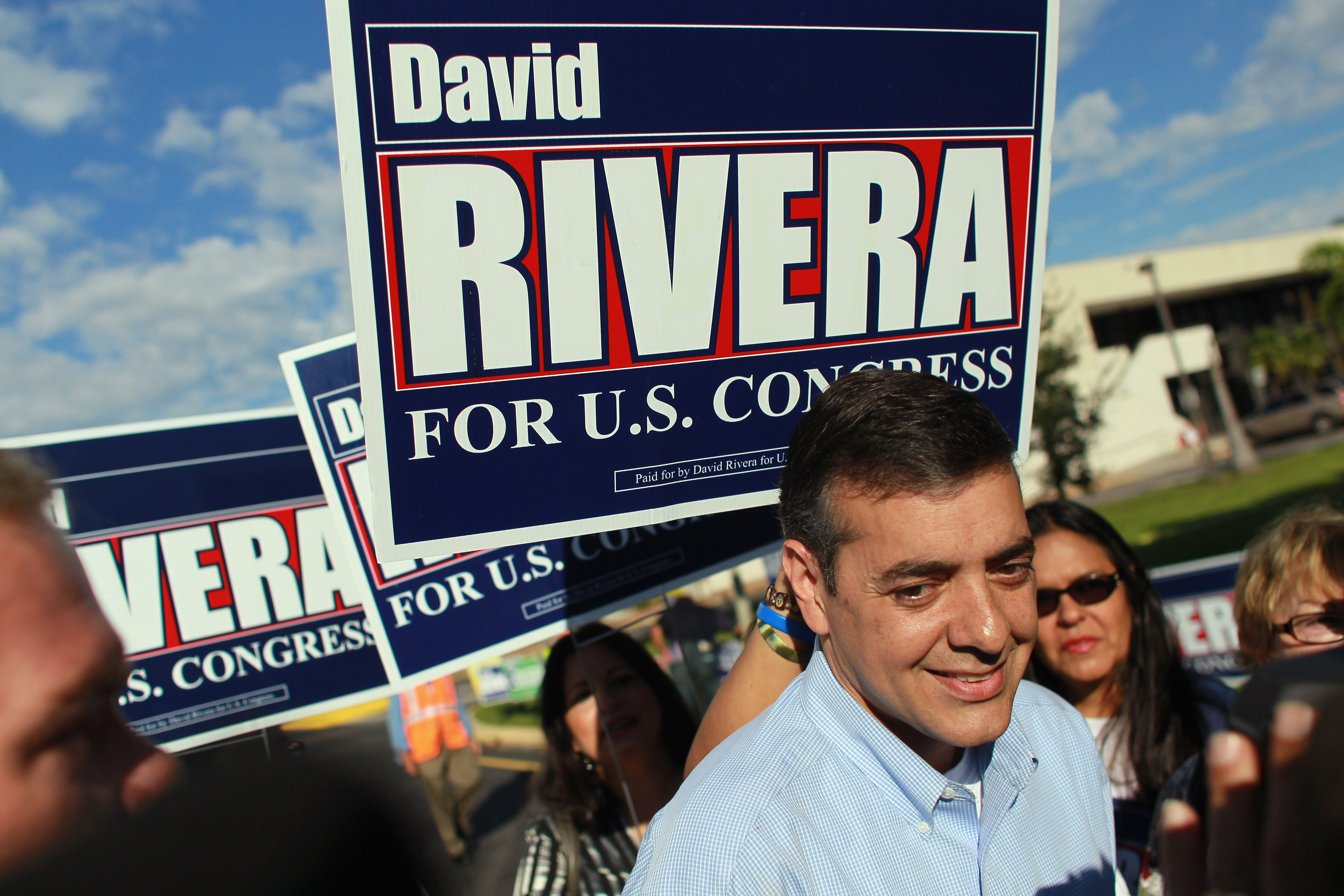 Republican Congressional candidate David Rivera is greeted by supporters as he campaigns at an early voting site on October 20, 2010 in Miami, Florida. Rivera is running against Democrat Joe Garcia for the 25th congressional district. (Photo by Joe Raedle/Getty Images)