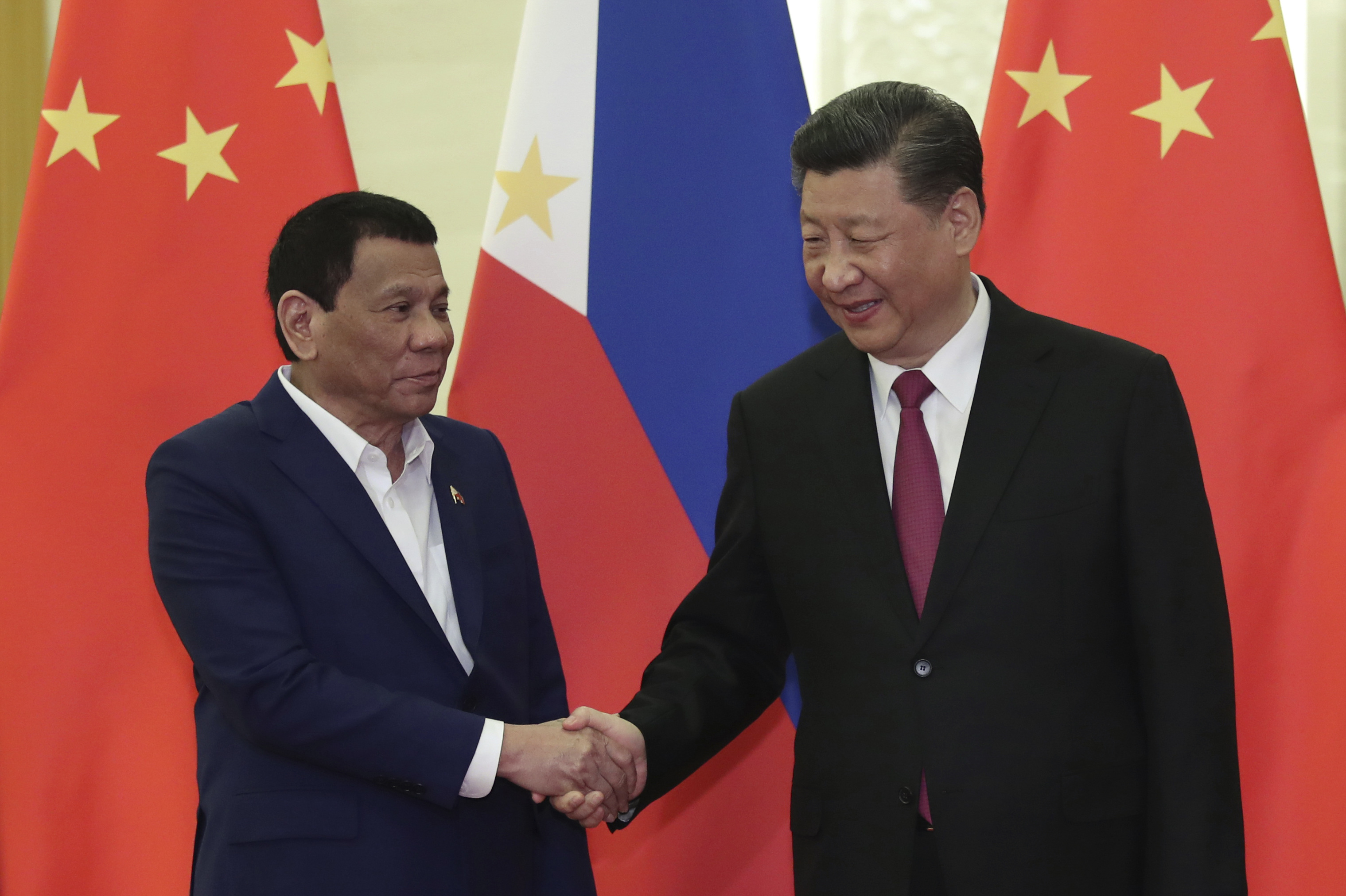 Philippine President Rodrigo Duterte, left, shakes hands with Chinese President Xi Jinping, right, before the meeting at the Great Hall of People in Beijing, China on April 25, 2019. (Photo by Kenzaburo Fukuhara/Kyodo News - Pool/Getty Images)