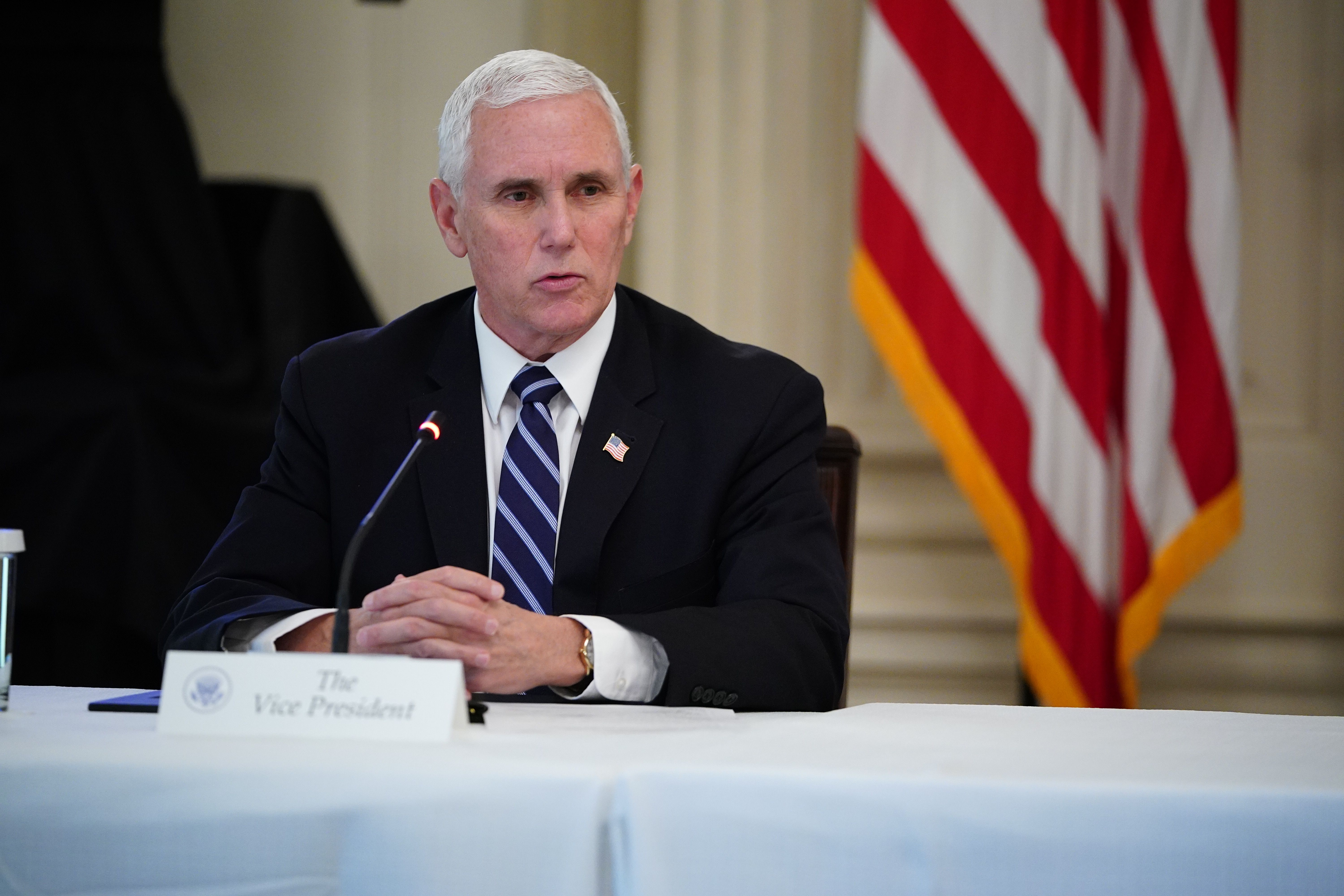 US Vice President Mike Pence speaks during a roundtable discussion with industry executives on Opening Up America Again in the State Dining Room of the White House in Washington, DC on April 29, 2020 (Photo by MANDEL NGAN/AFP via Getty Images)
