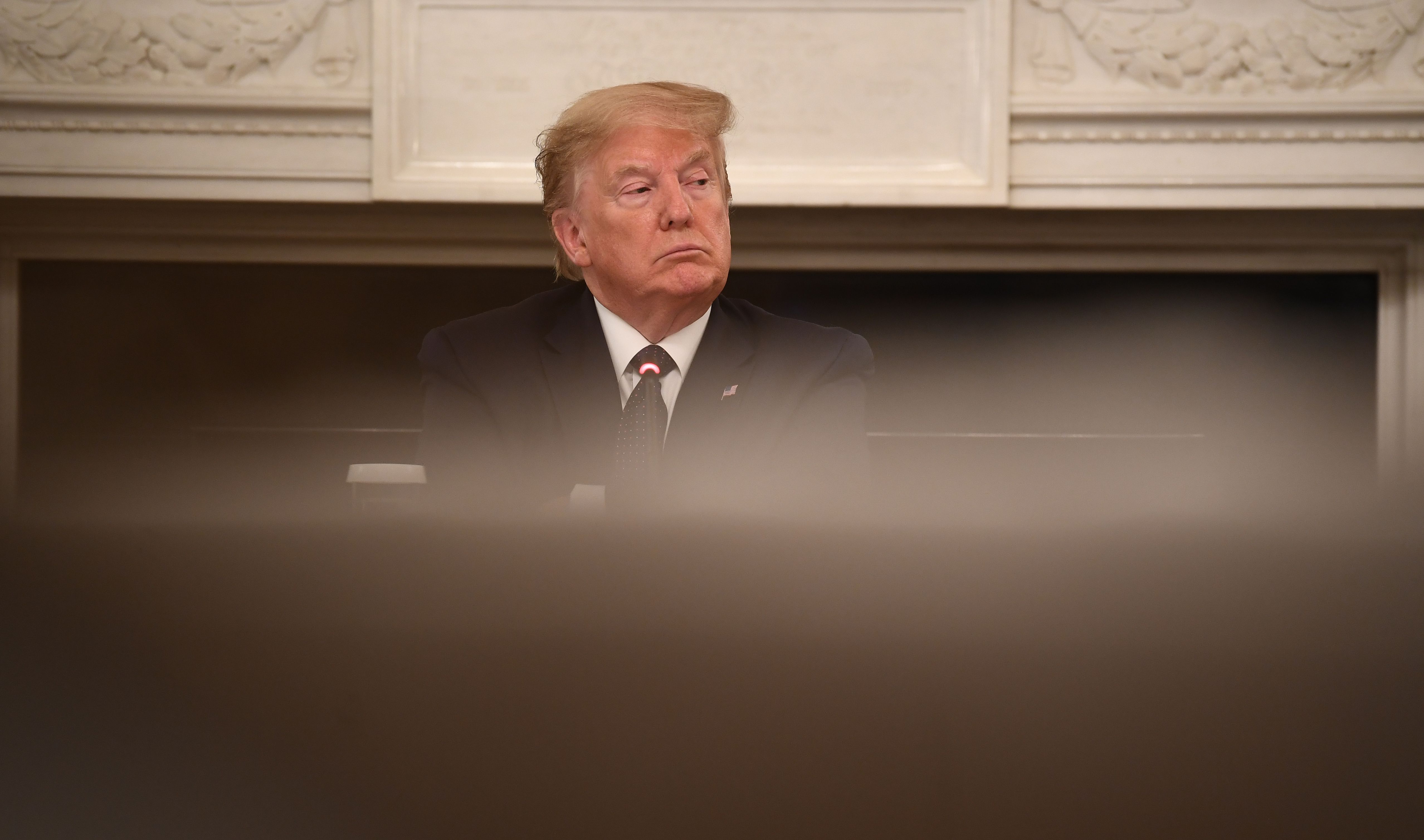 US President Donald Trump looks on during a meeting with resturant executives in the State Dining room of the White House May 18, 2020, in Washington, DC. (Photo by BRENDAN SMIALOWSKI/AFP via Getty Images)