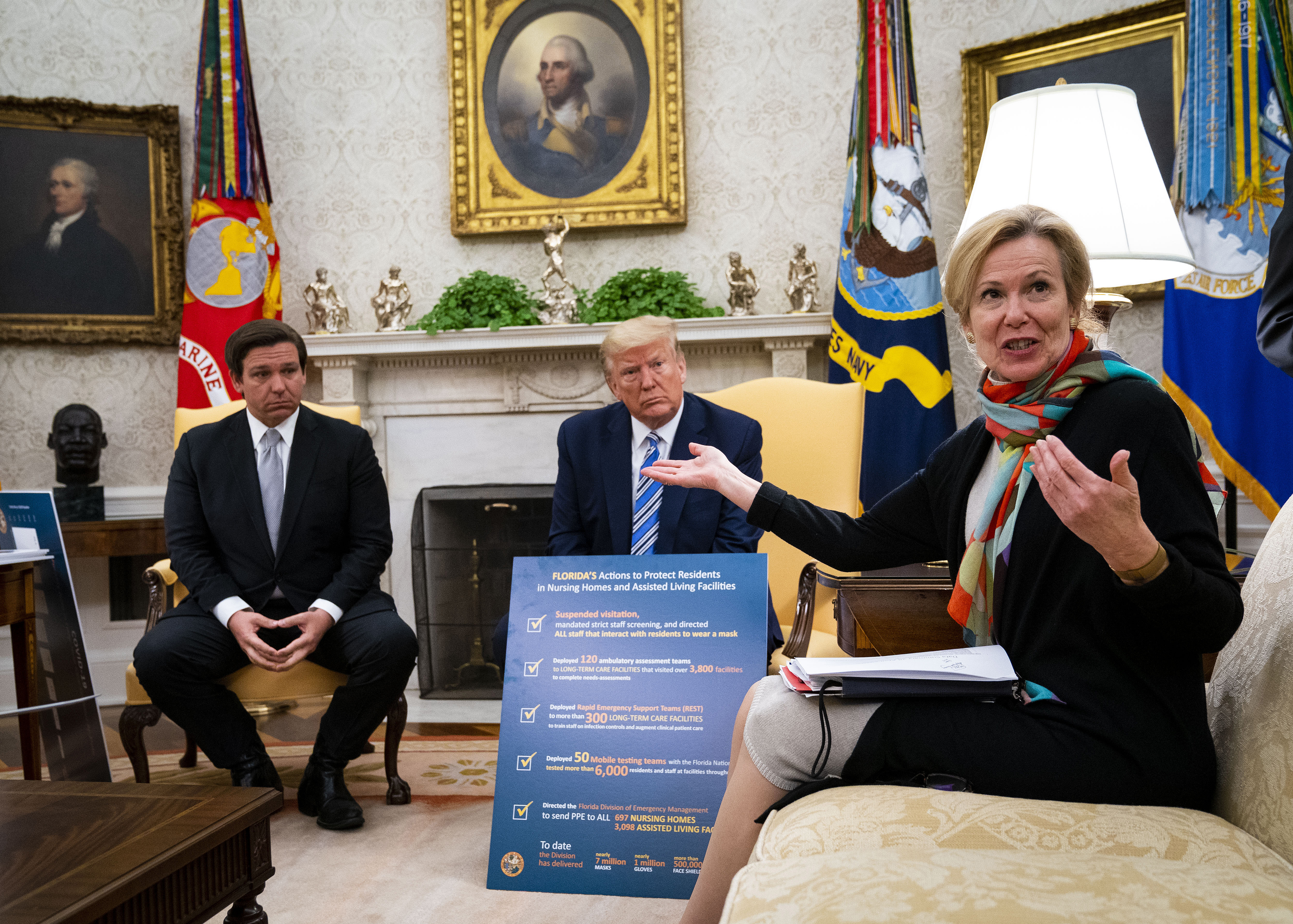 WASHINGTON, DC - APRIL 28: White House Coronavirus Task Force Coordinator Deborah Birx (R) answers a question while meeting with Florida Gov. Ron DeSantis (L) and U.S. President Donald Trump and in the Oval Office of the White House on April 28, 2020 in Washington, DC. Trump met with DeSantis to discuss ways that Florida is planning to gradually re-open the state in the wake of the COVID-19 pandemic. (Photo by Doug Mills/The New York Times/Pool/Getty Images)