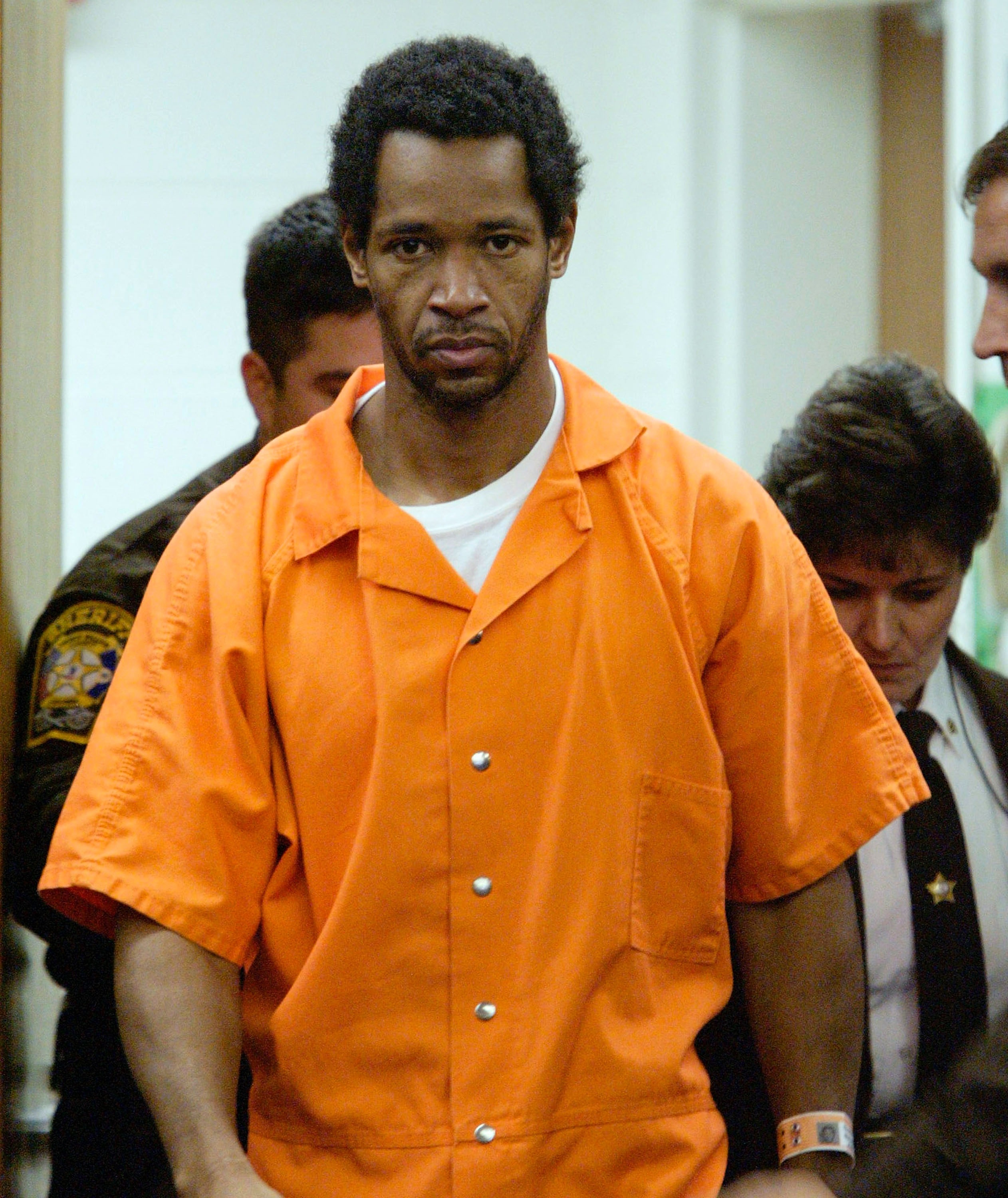 Sniper suspect John Allen Muhammad arrives in Prince William Circuit Court to appear before Judge Leroy F. Millette for a hearing to appoint council November 13, 2002 in Manassas, Virginia. (Photo by Jahi Chikwendiu-Pool/Getty Images)