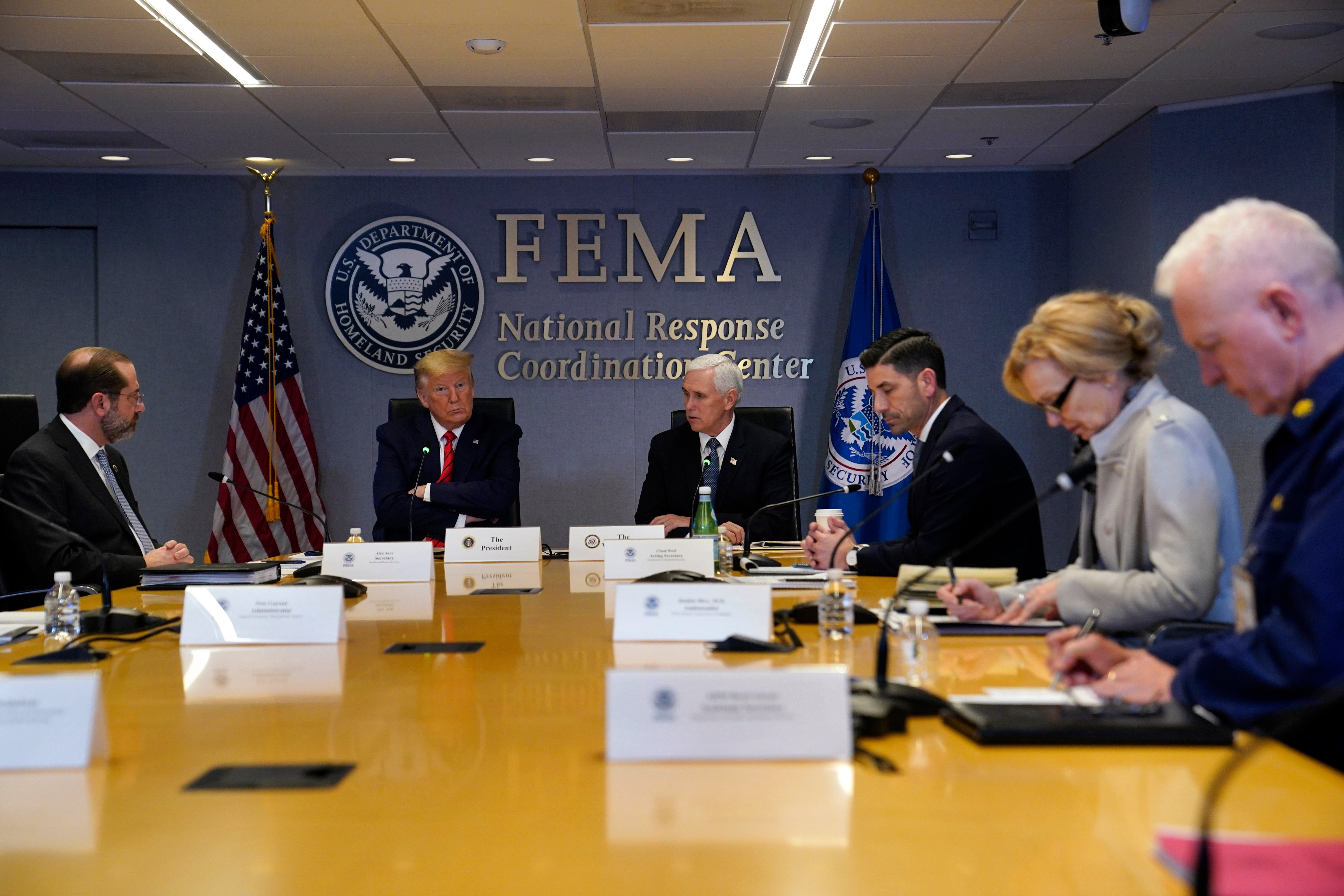 WASHINGTON, DC - MARCH 19: President Donald Trump attends a teleconference with governors at the Federal Emergency Management Agency headquarters From left, Department of Health and Human Services Secretary Alex Azar, Trump, Vice President Mike Pence, Acting Secretary of Homeland Security Chad Wolf, White House coronavirus response coordinator Dr. Deborah Birx and Adm. Brett Giroir, assistant secretary for health on March 19, 2020 in Washington, DC. With Americans testing positive from coronavirus rising President Trump is asking Congress for $1 trillion aid package to deal with the COVID-19 pandemic. (Photo by Evan Vucci-Pool/Getty Images)
