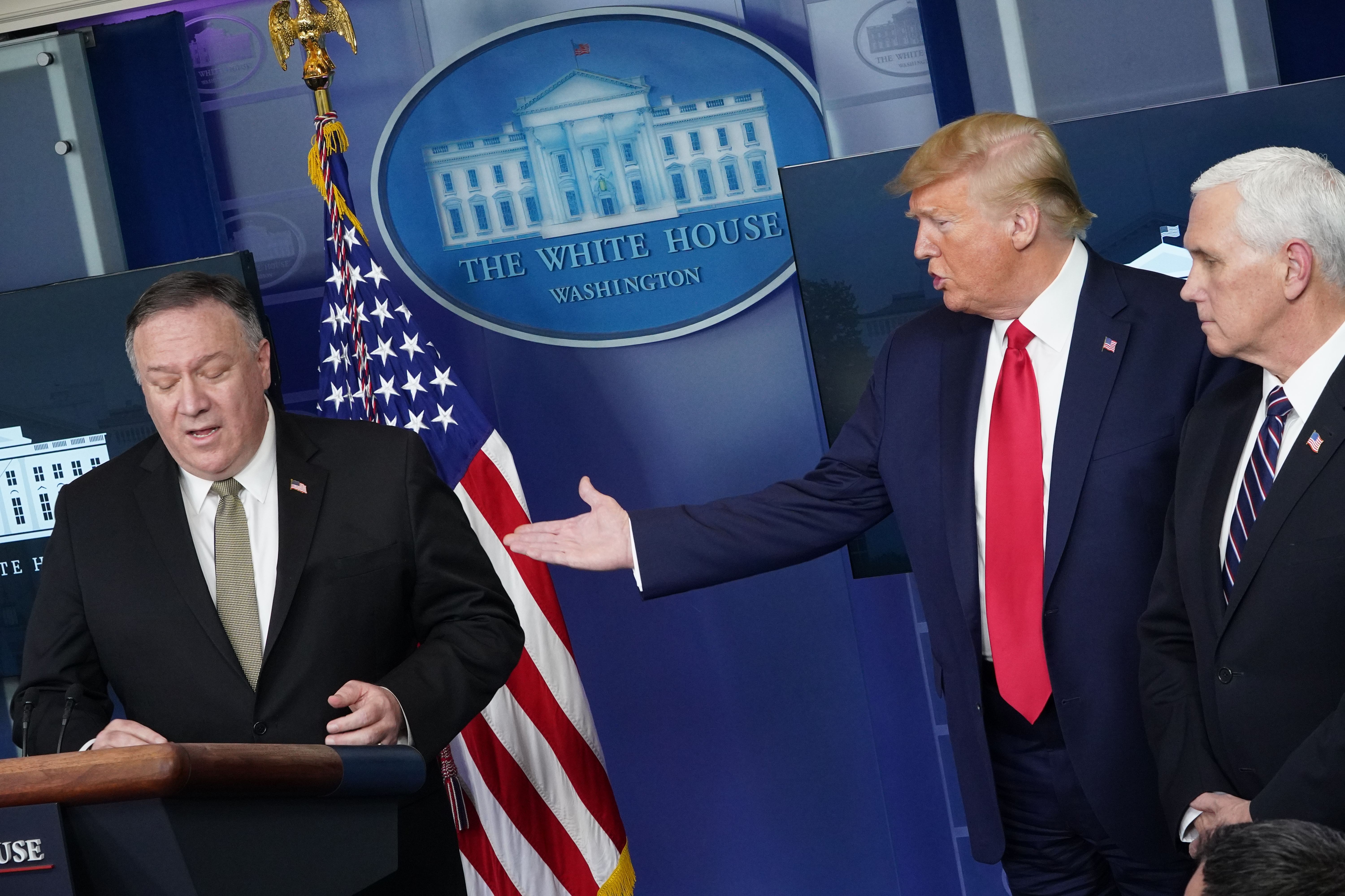 US Secretary of State Mike Pompeo, with US President Donald Trump and US Vice President Mike Pence, speaks during the daily briefing on the novel coronavirus, COVID-19, in the Brady Briefing Room at the White House on April 8, 2020, in Washington, DC. (Photo by MANDEL NGAN/AFP via Getty Images)