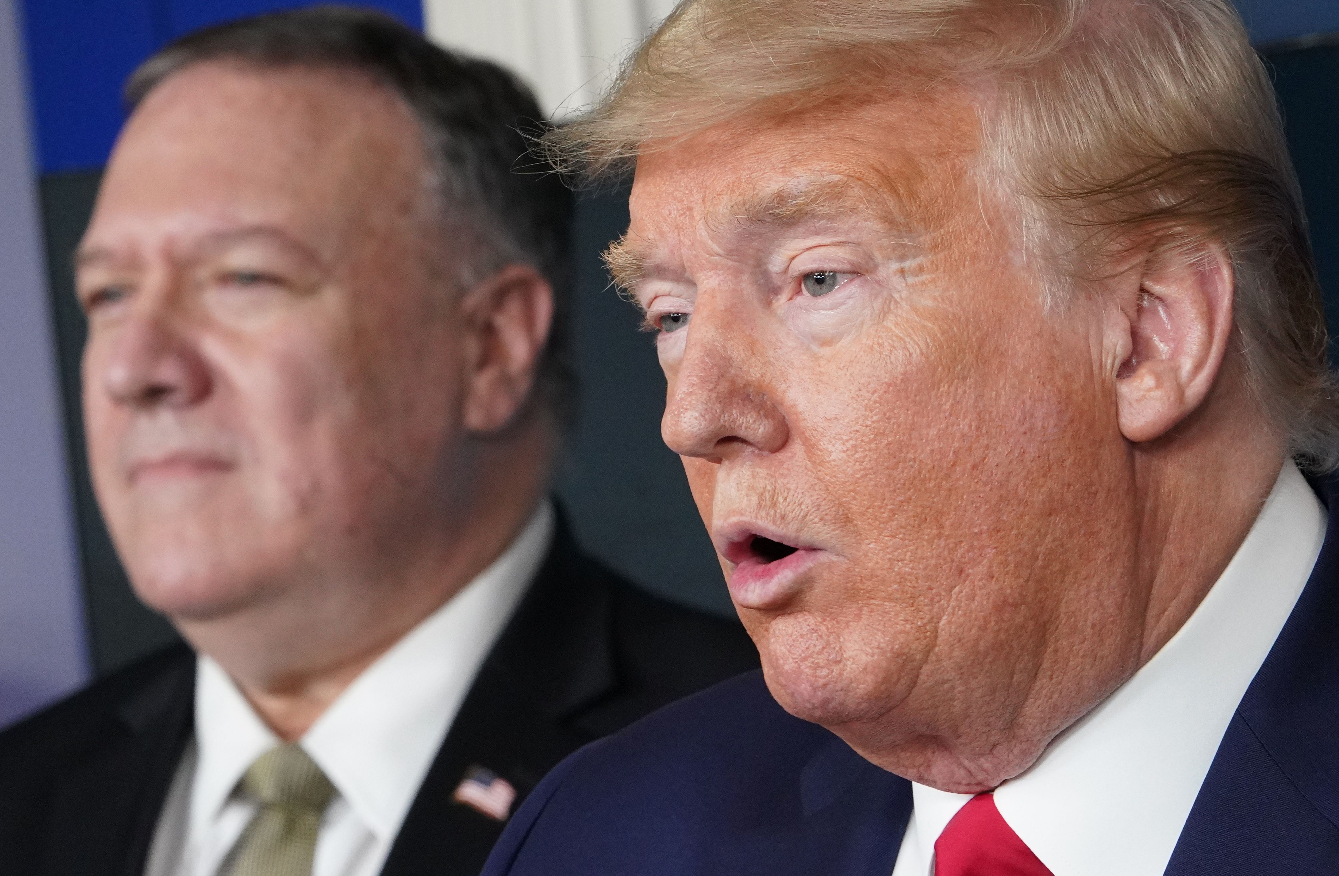 US Secretary of States Mike Pompeo watches US President Donald Trump speak during the daily briefing on the novel coronavirus, COVID-19, in the Brady Briefing Room at the White House on April 8, 2020, in Washington, DC. (Photo by MANDEL NGAN/AFP via Getty Images)