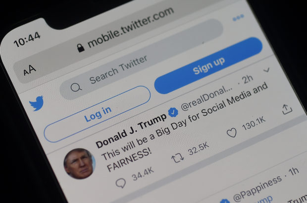 The Twitter page of US President Donald Trump indicating an executive order on May 28, 2020, after threatening to shutter social media platforms. (Photo by OLIVIER DOULIERY/AFP via Getty Images)