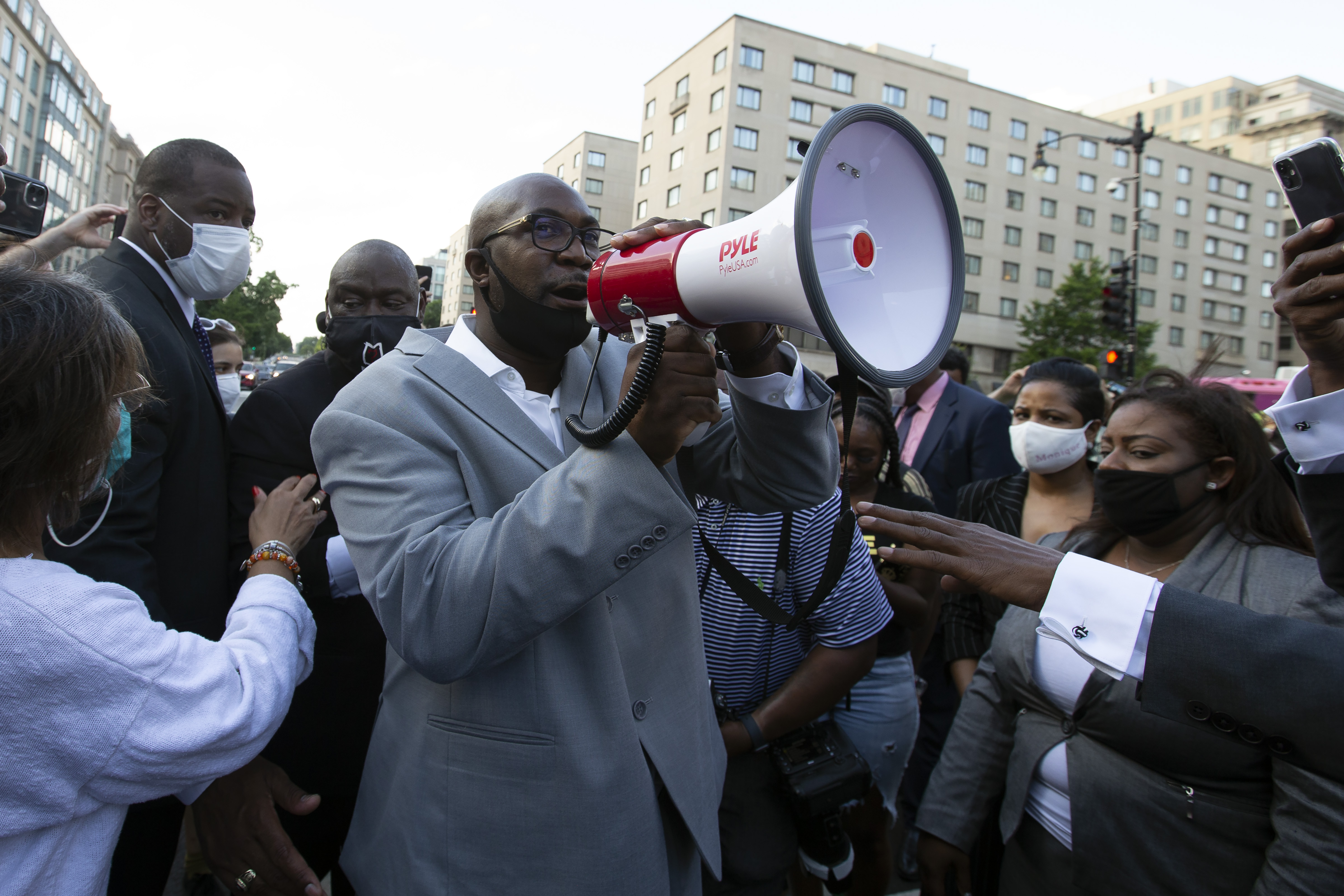 Philonise Floyd (C), George Floyd's brother, speaks to a crowd as he marches with others on Black Lives Matter Plaza near the White House, to protest police brutality and racism, on June 10, 2020 in Washington, DC. (Photo by JOSE LUIS MAGANA/AFP via Getty Images)