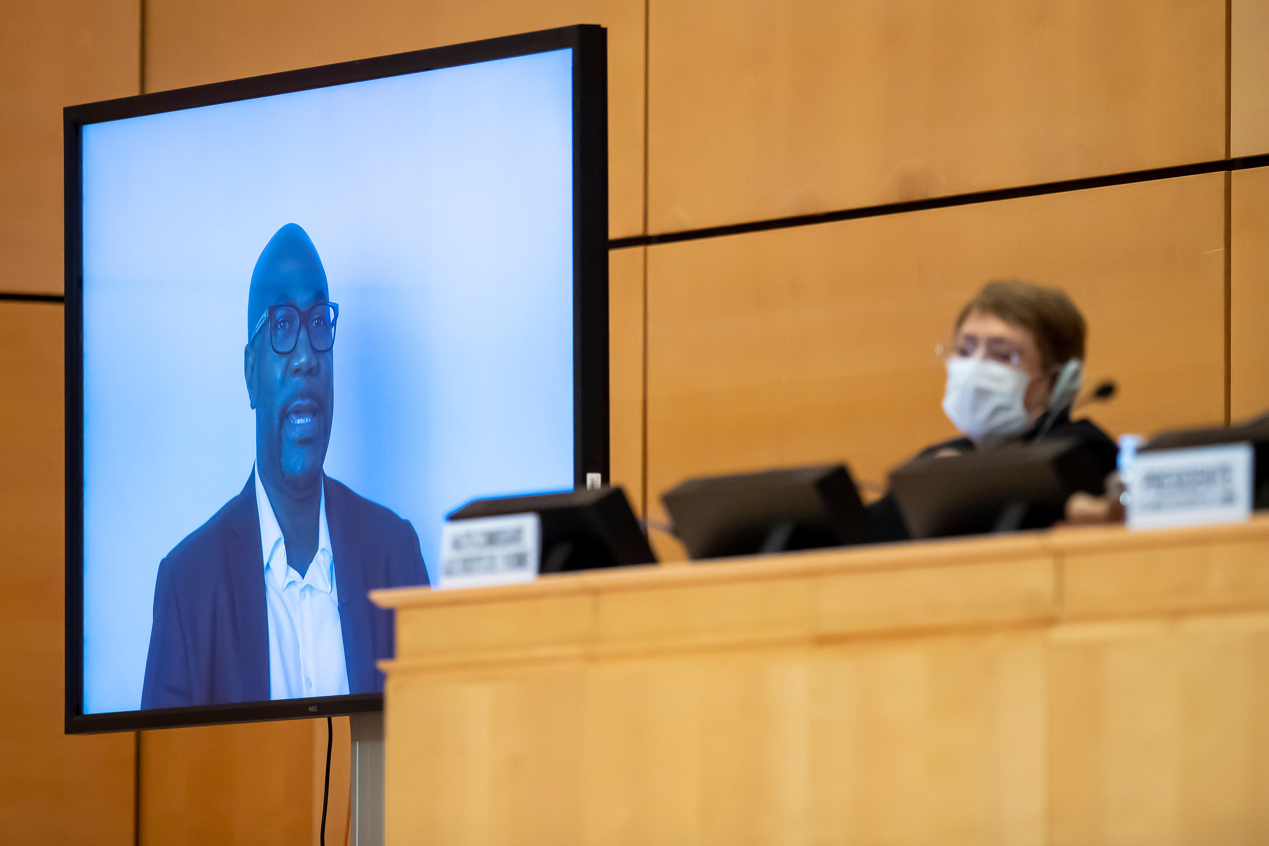 United Nations High Commissioner for Human Rights Michelle Bachelet looks on next to a TV screen showing George Floyd's brother, Philonise Floyd speaking via video message during an urgent debate on "systemic racism" in the United States and beyond at the Human Rights Council on June 17, 2020 in Geneva. (Photo: Martial Trezzini/Pool/AFP via Getty Images)