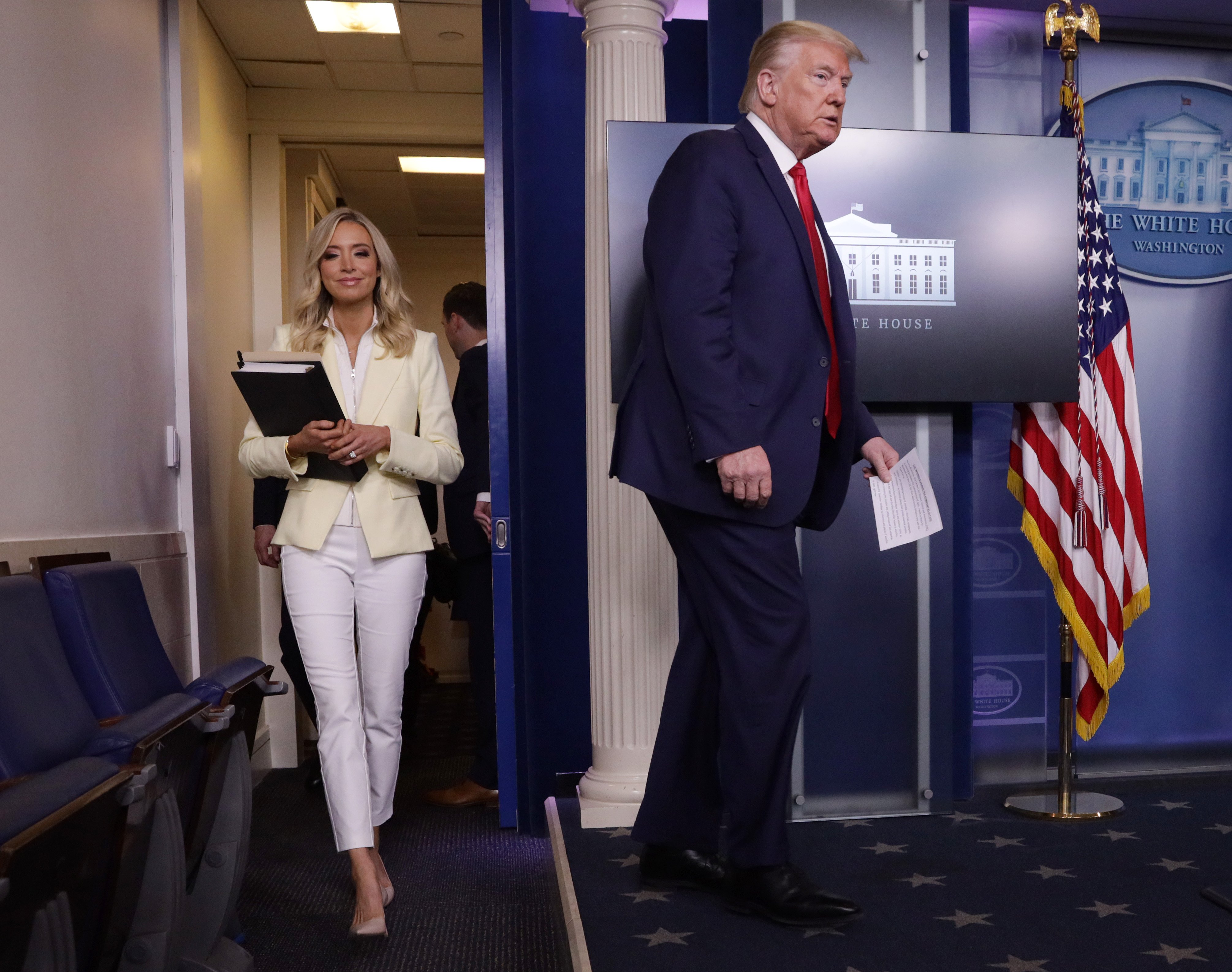 WASHINGTON, DC - MAY 22: U.S. President Donald Trump arrives with White House Press Secretary Kayleigh McEnany to make a statement in the briefing room at the White House on May 22, 2020 in Washington, DC. President Trump announced news CDC guidelines that churches and places of worship are essential and must reopen now. (Photo by Alex Wong/Getty Images)