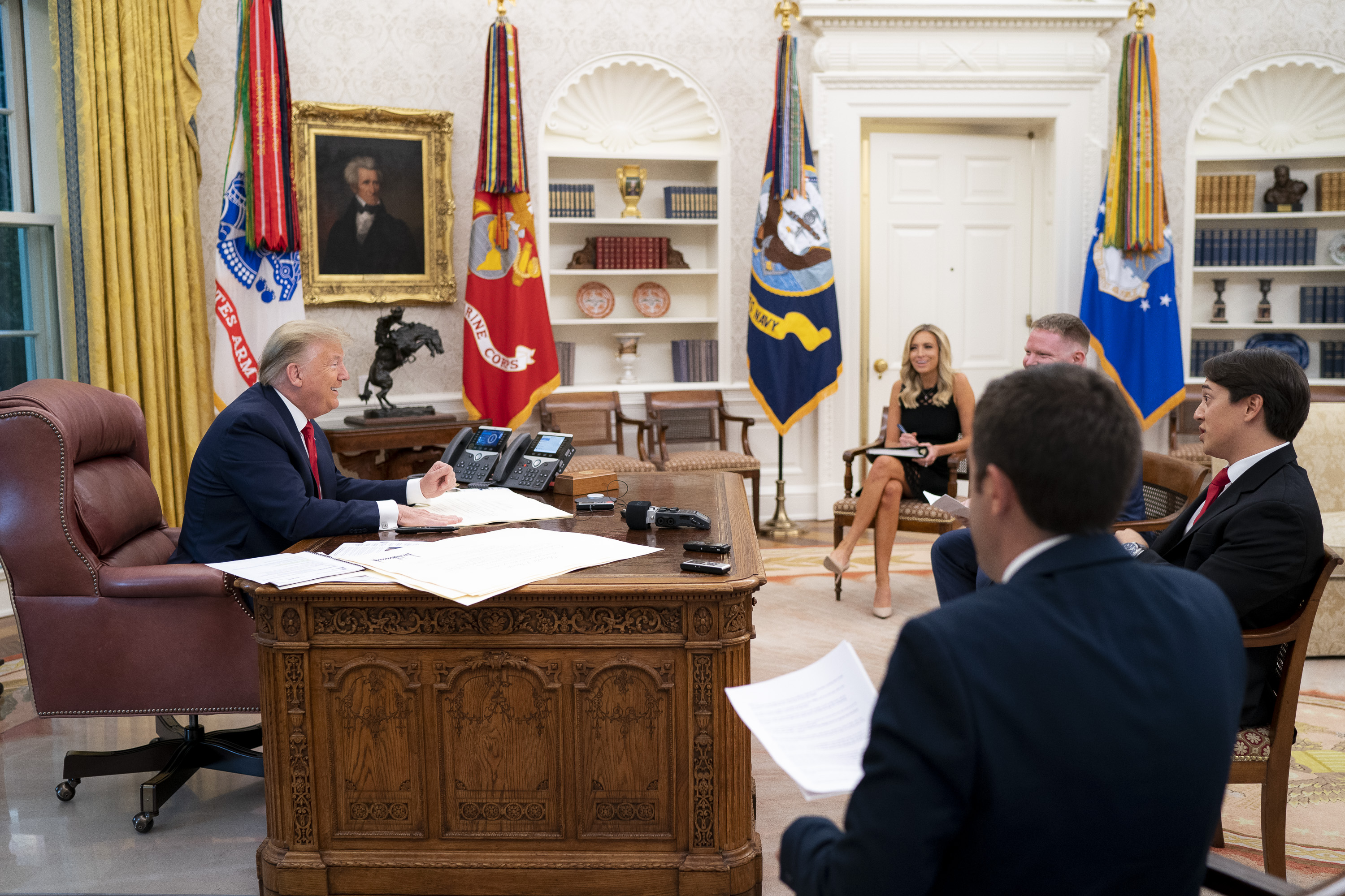 President Donald Trump sits down for an Oval Office interview with Daily Caller's Christian Datoc, Vince Coglianese, and Geoff Ingersoll (White House Photo by Tia Dufour)