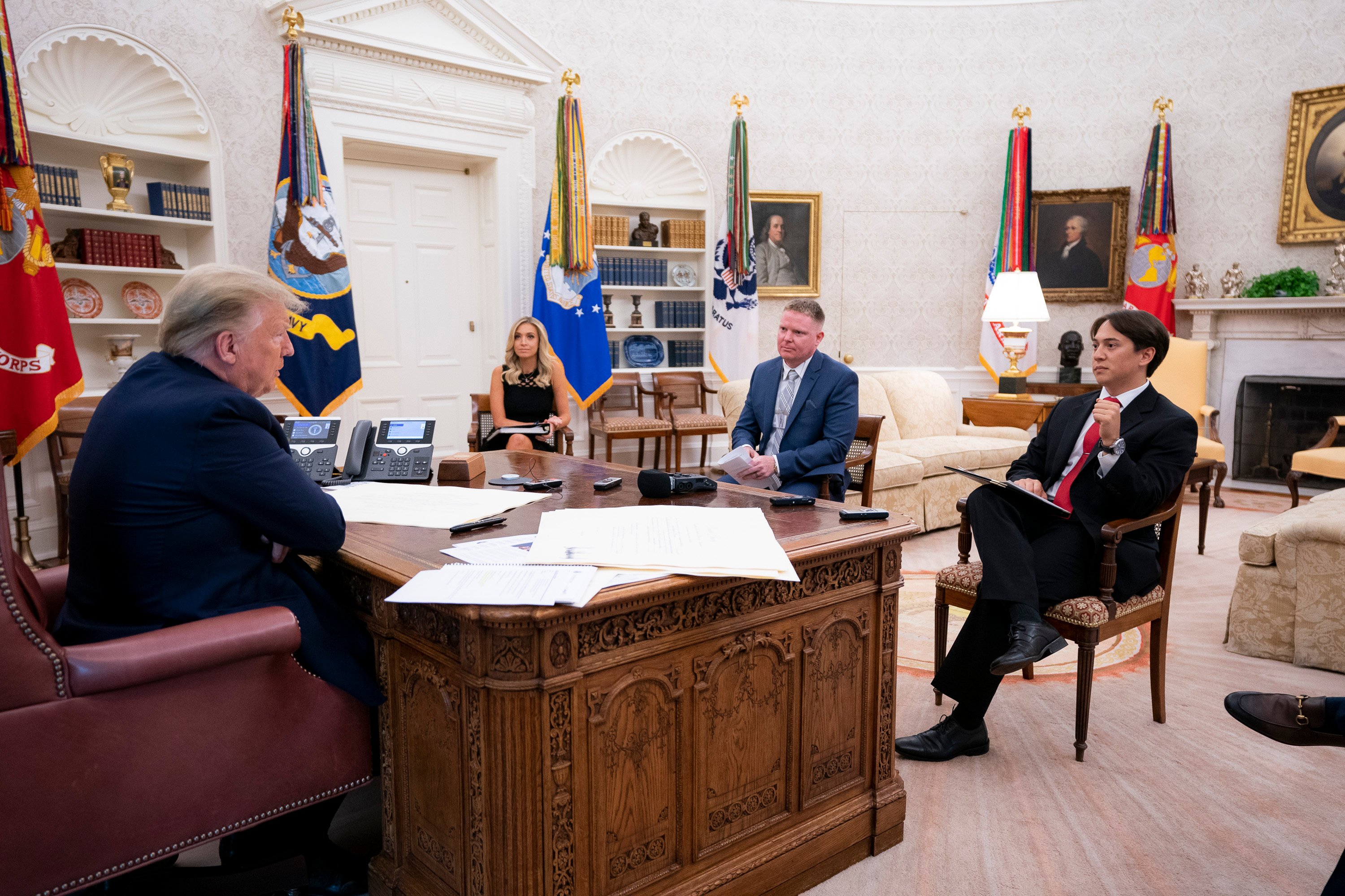President Donald Trump sits down for an Oval Office interview with Daily Caller's Christian Datoc, Vince Coglianese, and Geoff Ingersoll (White House Photo by Tia Dufour)