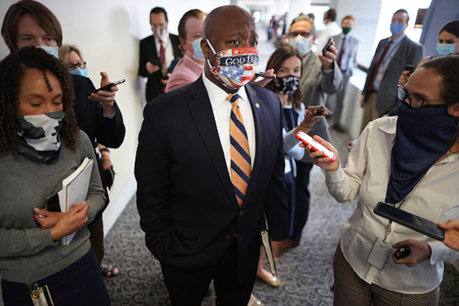 WASHINGTON, DC - JUNE 09: Sen. Tim Scott (R-SC), the only African-American Republican senator, talks to reporters following the weekly Senate Republican policy luncheon in the Hart Senate Office Building on Capitol Hill June 09, 2020 in Washington, DC. As a response to the recent killings of unarmed black people by police, Democrats from the House and Senate introduced legislation Monday that would change the way law enforcement officers operate, use deadly force and be held accountable for wrongdoing. President Donald Trump opposes the legislation and it is unclear if Republicans will take up the measure in the Senate. (Photo by Chip Somodevilla/Getty Images)
