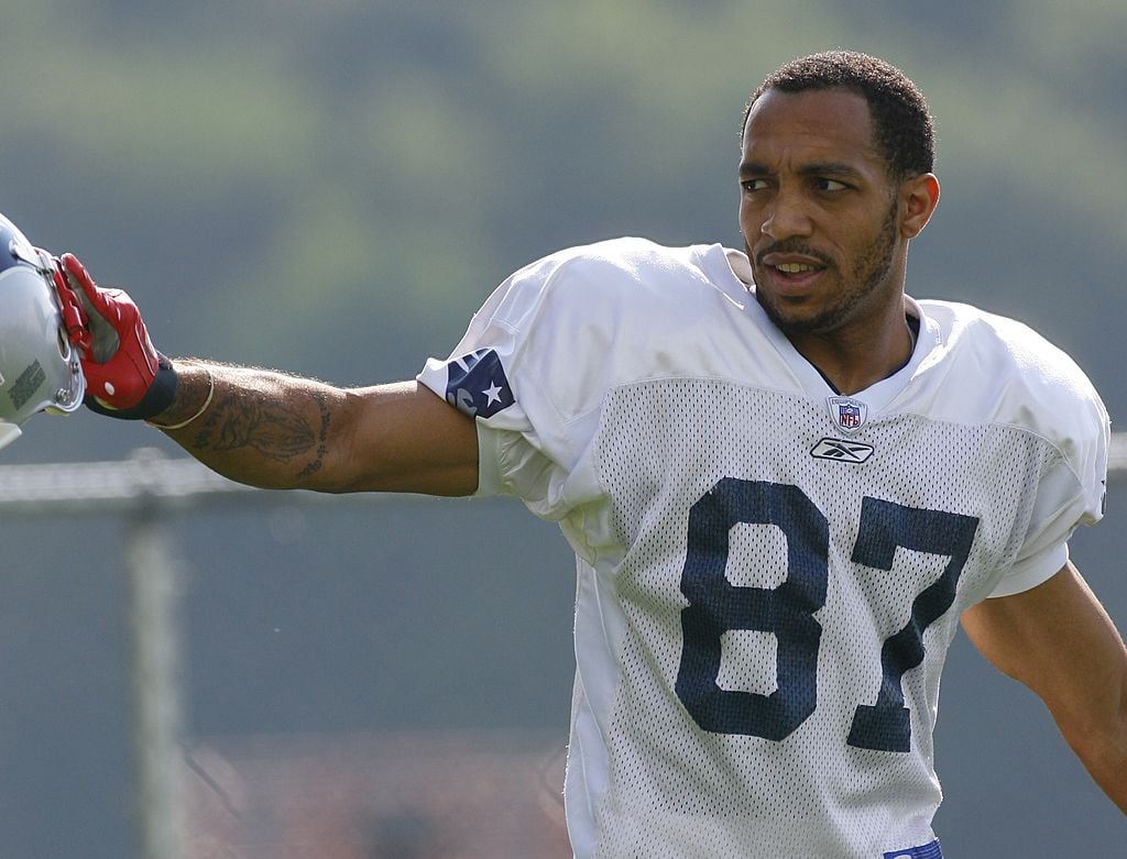 FOXBORO, MA - JULY 27: Wide receiver Reche Caldwell #87 of the New England Patriots reacts to fans during training camp practice on July 27, 2007 at Gillette Stadium in Foxboro, Massachusetts. (Photo by Jim Rogash/Getty Images)