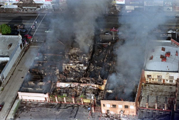 Smoke billows from burning buildings in Los Angeles April 30, 1992.(REUTERS/Sam Mircovich)
