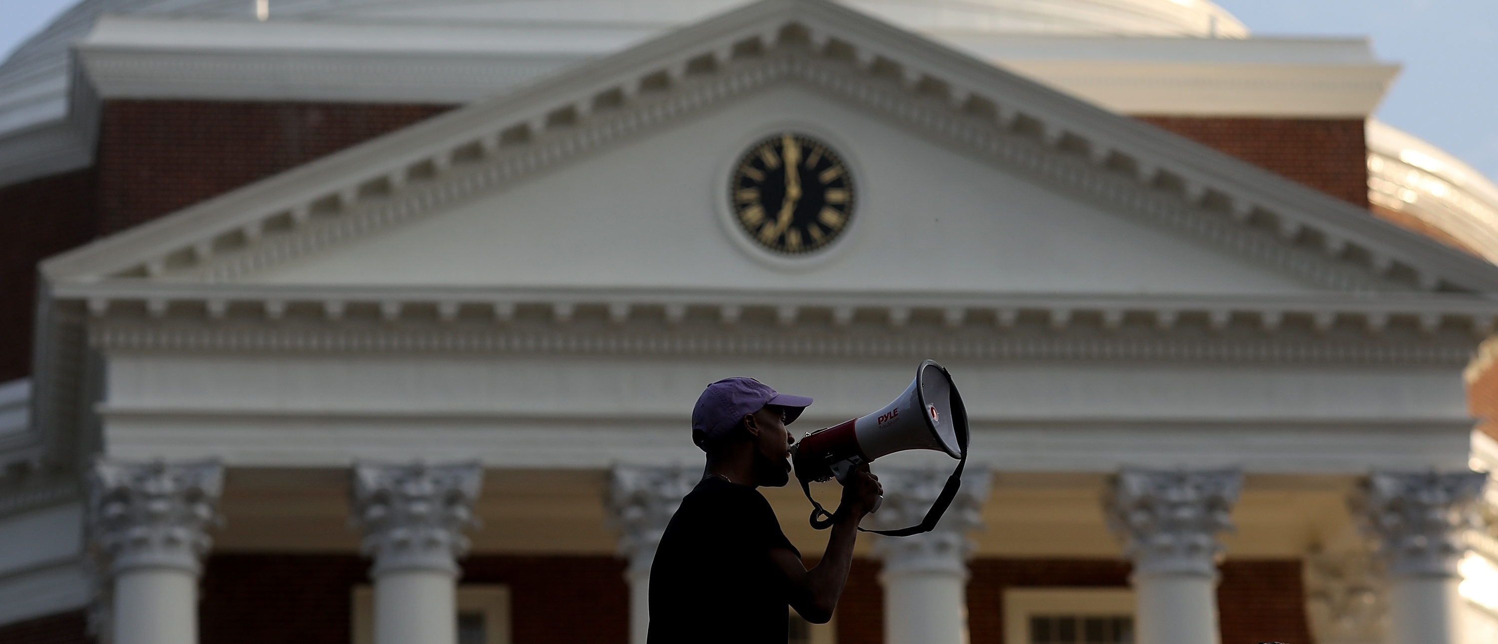CHARLOTTESVILLE, VA - AUGUST 11: Protesters with the group Students Act Against White Supremacy speak on the campus of the University of Virginia during an event marking the one year anniversary of a deadly clash between white supremacists and counter protesters August 11, 2018 in Charlottesville, Virginia. Charlottesville has been declared in a state of emergency by Virginia Gov. Ralph Northam as the city braces for the one year anniversary of the deadly clash between white supremacist forces and counter protesters over the potential removal of Confederate statues of Robert E. Lee and Stonewall Jackson. A ÒUnite the RightÓ rally featuring some of the same groups is planned for tomorrow in Washington, DC. (Photo by Win McNamee/Getty Images)