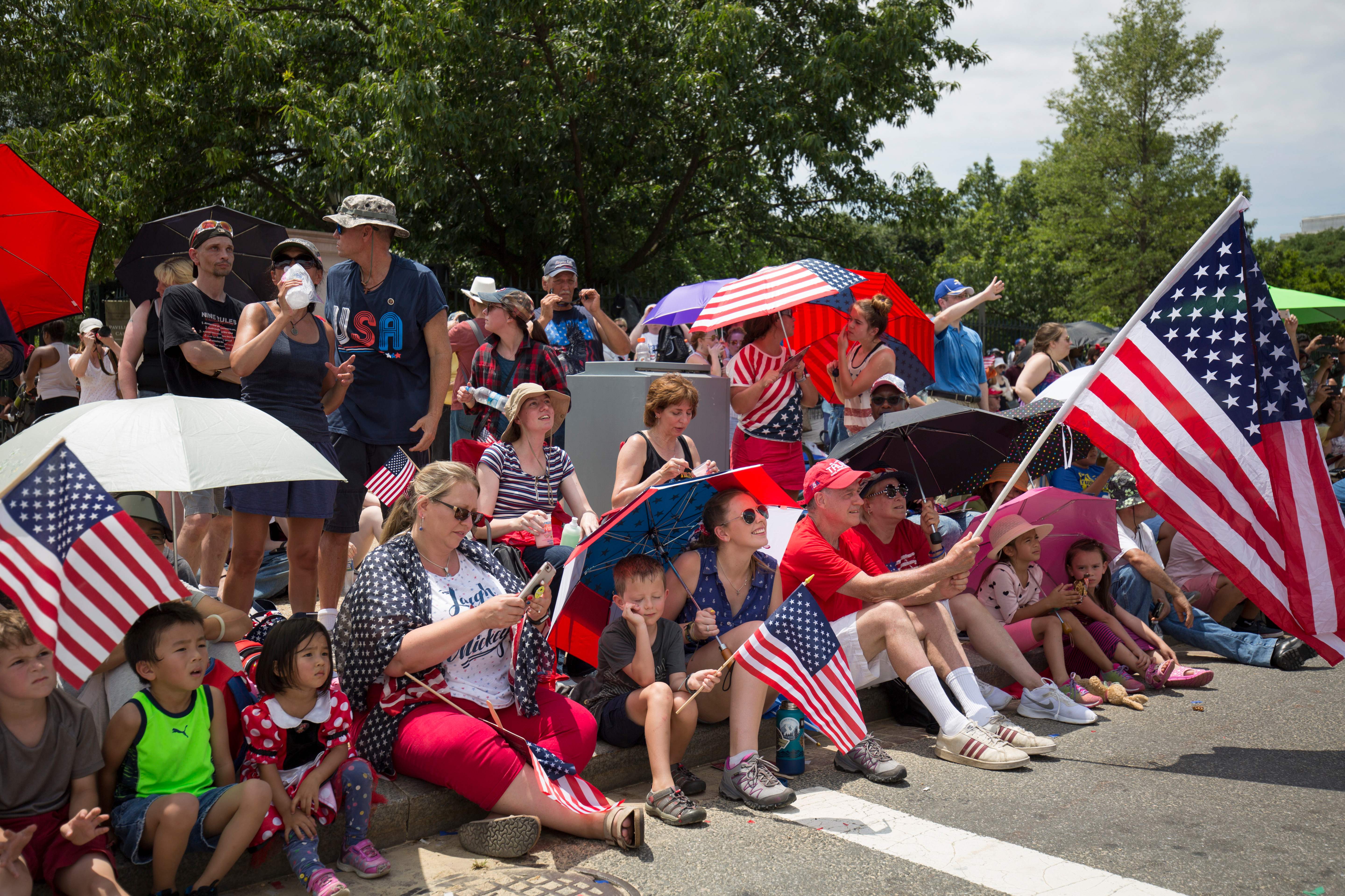 People watch the Independence Day parade in Washington, DC, on July 4, 2019. (ALASTAIR PIKE/AFP via Getty Images)