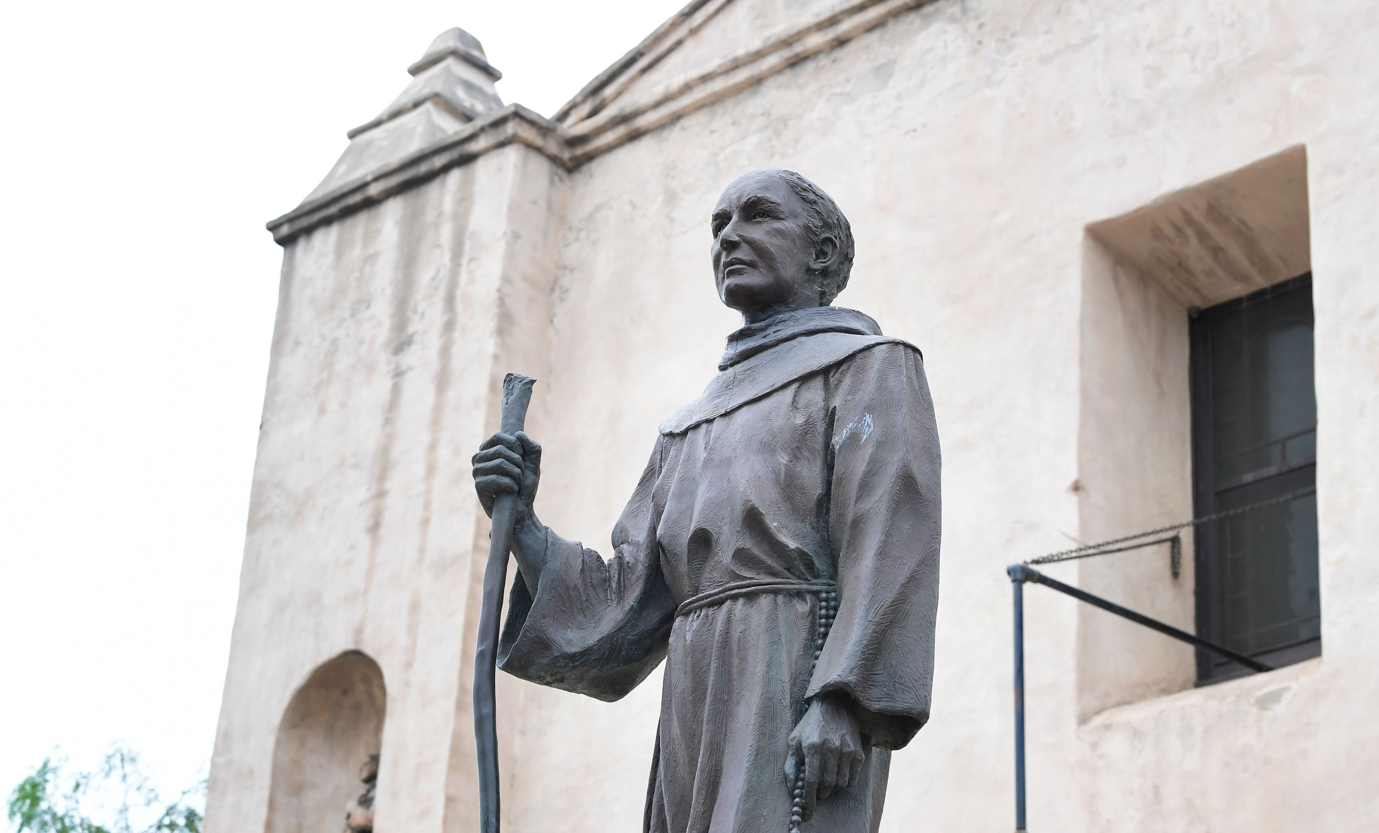 A statue of Father Junipero Serra is seen in front of the San Gabriel Mission in San Gabriel, California on June 21, 2020. (Photo by FREDERIC J. BROWN/AFP via Getty Images)