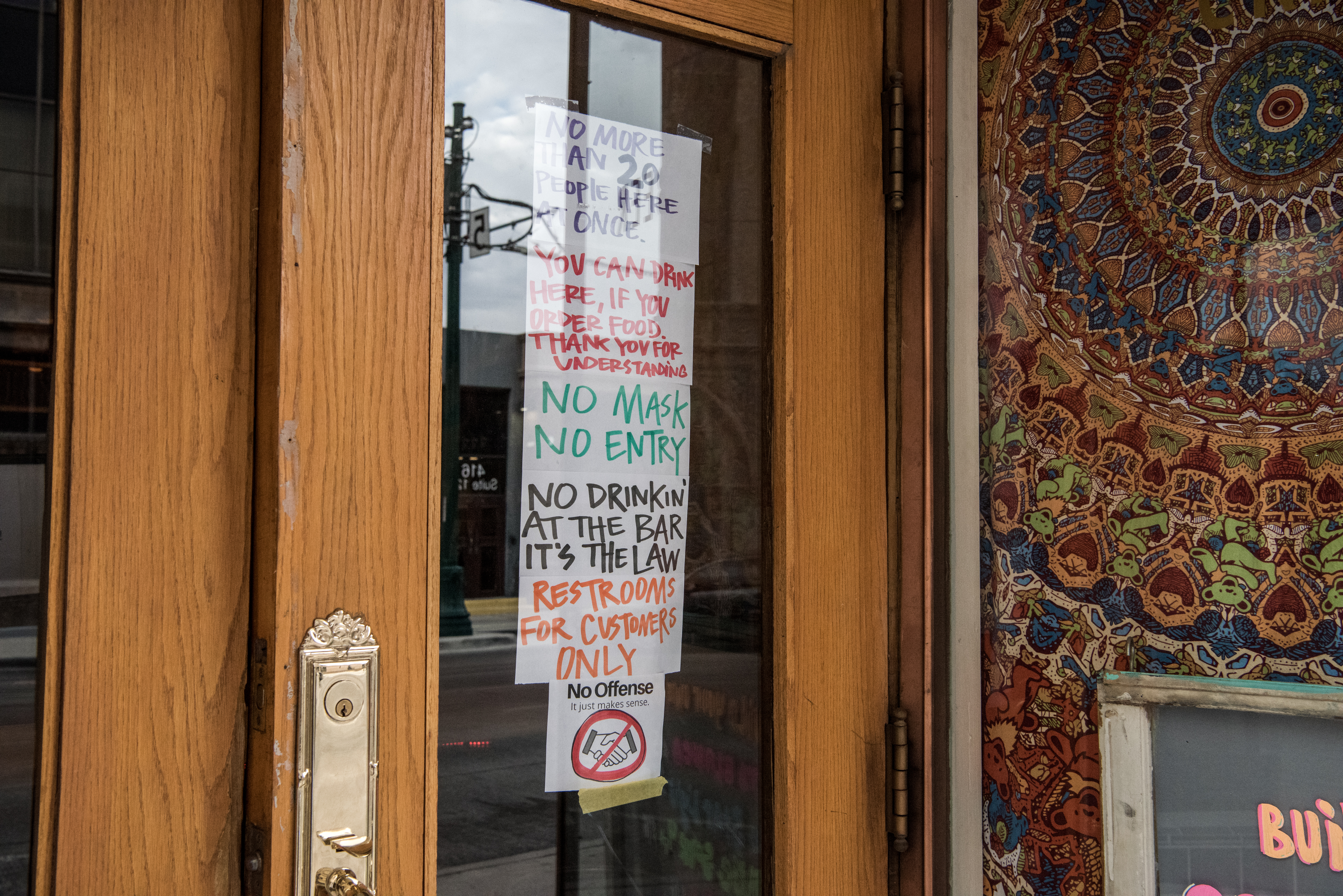 EL PASO, TX - JULY 1: Signs are posted at the entrance to Craft and Social, a beer bar, on July 1, 2020 in El Paso, Texas. As coronavirus cases have surged in Texas, Gov. Greg Abbott has paused the state's reopening plan. (Photo by Cengiz Yar/Getty Images)