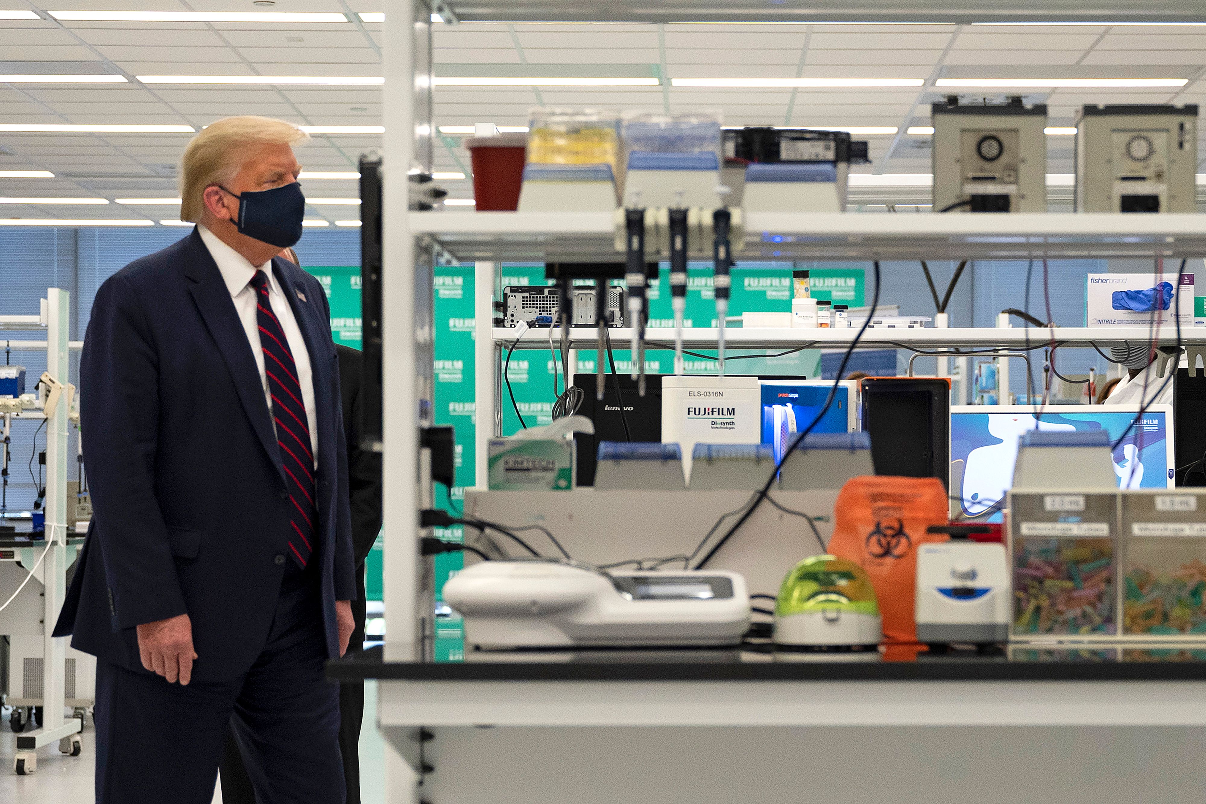 US President Donald Trump tours a Fujifilm lab where they are making components for a potential vaccine on July 27, 2020. (Jim Watson/AFP via Getty Images)