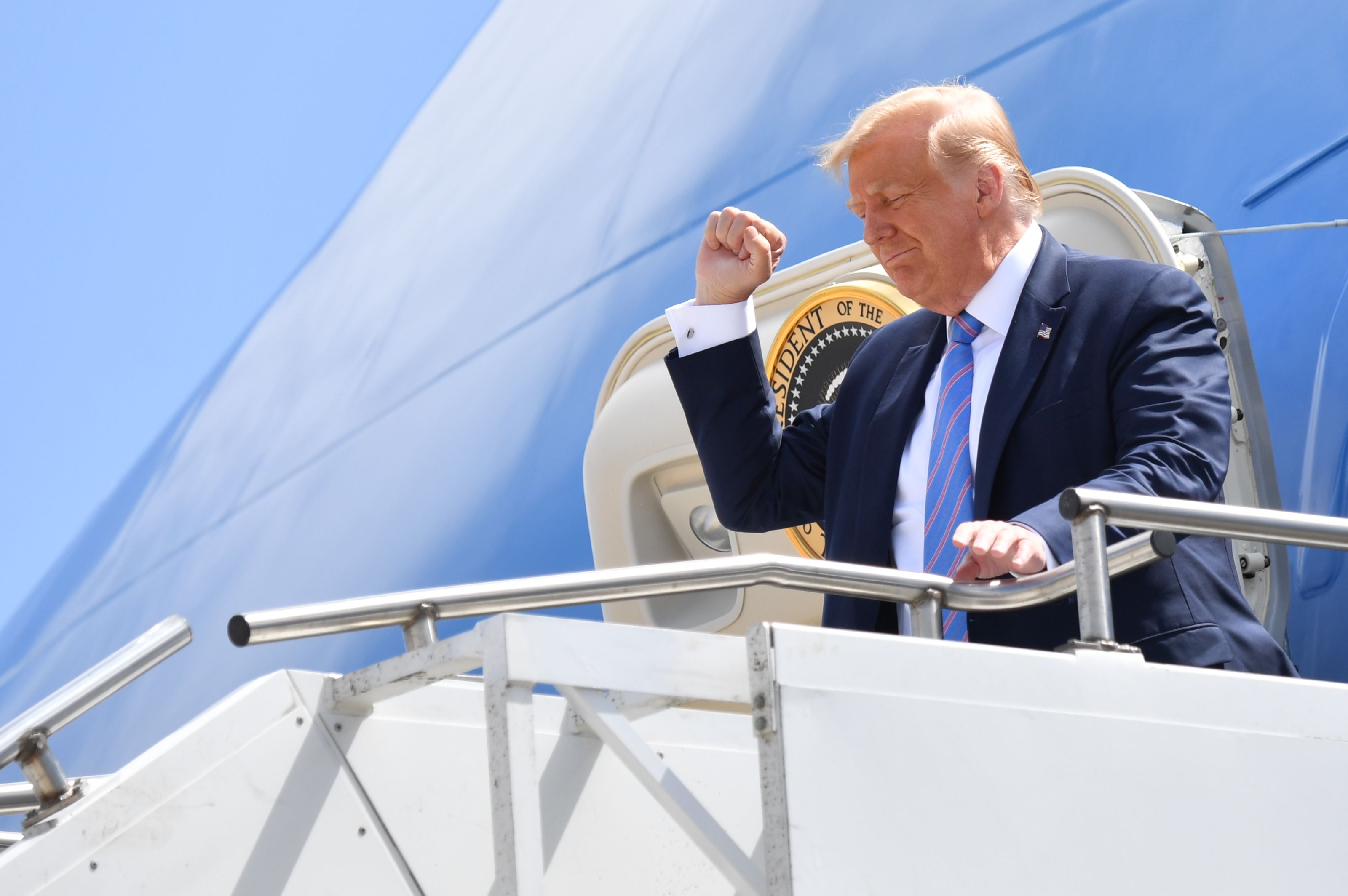 US President Donald Trump gestures as he walks off Air Force One on July 29, 2020 upon arrival at Midland Airport in Midland, Texas. (Photo by NICHOLAS KAMM/AFP via Getty Images)