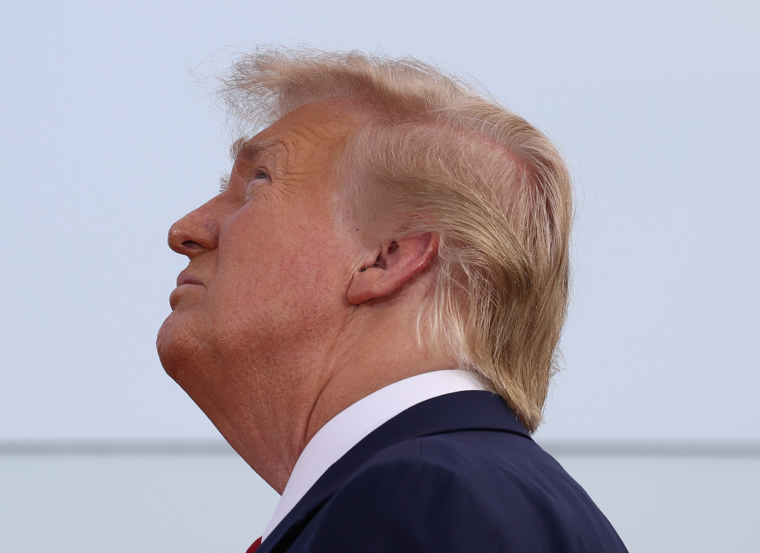 WASHINGTON, DC - JULY 04: President Donald Trump watches as military aircraft perform a flyover near the White House on July 04, 2020 in Washington, DC. President Trump is hosting a "Salute to America" celebration that includes flyovers by military aircraft and a large fireworks display. (Photo by Tasos Katopodis/Getty Images)