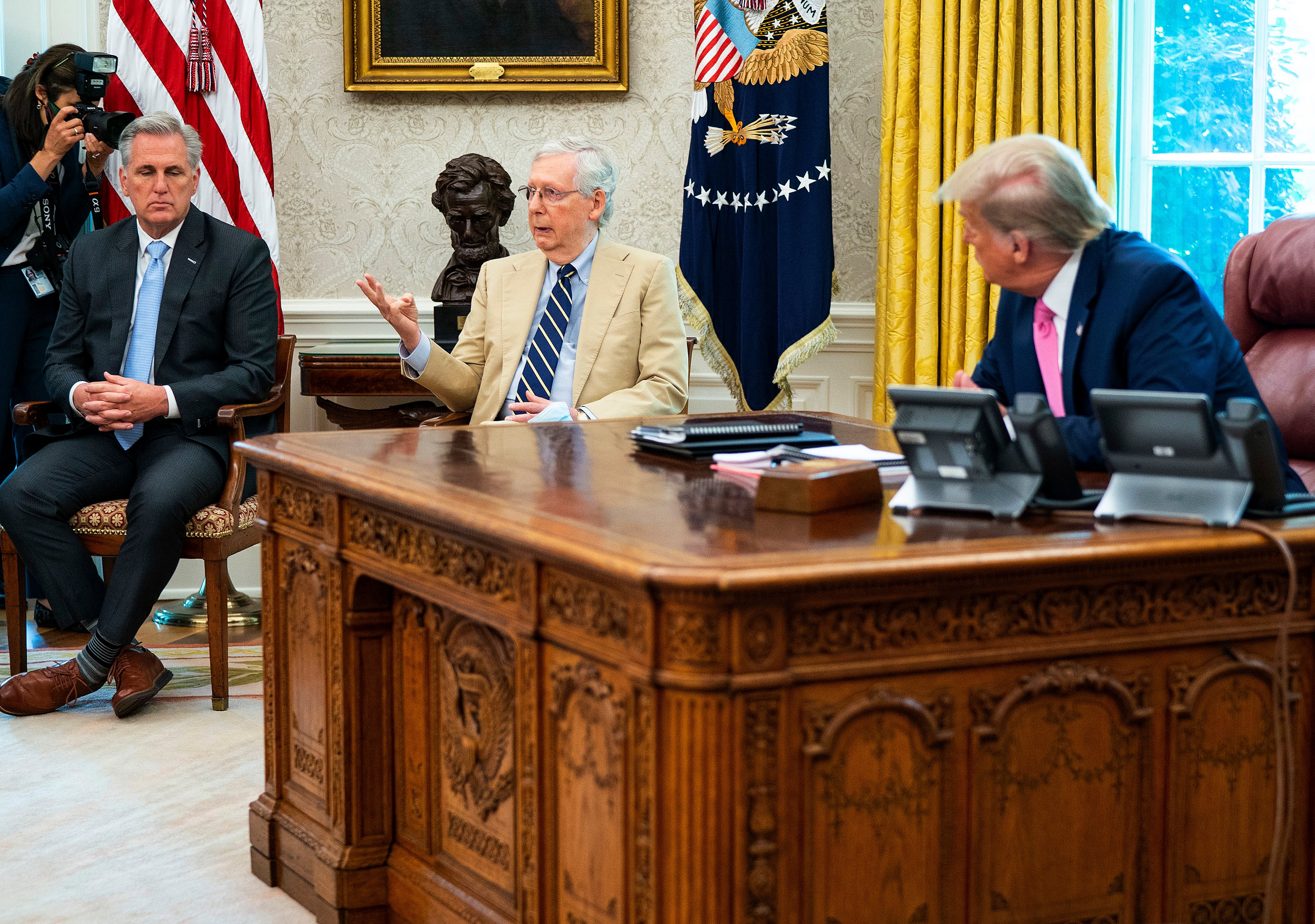 WASHINGTON, DC - JULY 20: U.S. President Donald Trump listens to Senate Majority Leader Mitch McConnell (R-KY) (C) during a meeting with cabinet members and House Minority Leader Kevin McCarthy (R-CA) (L) in the Oval Office at the White House July 20, 2020 in Washington, DC. Trump and the congressional leaders talked about a proposed new round of financial stimulus to help the economy during the ongoing global coronavirus pandemic. (Photo by Doug Mills/Getty Images)