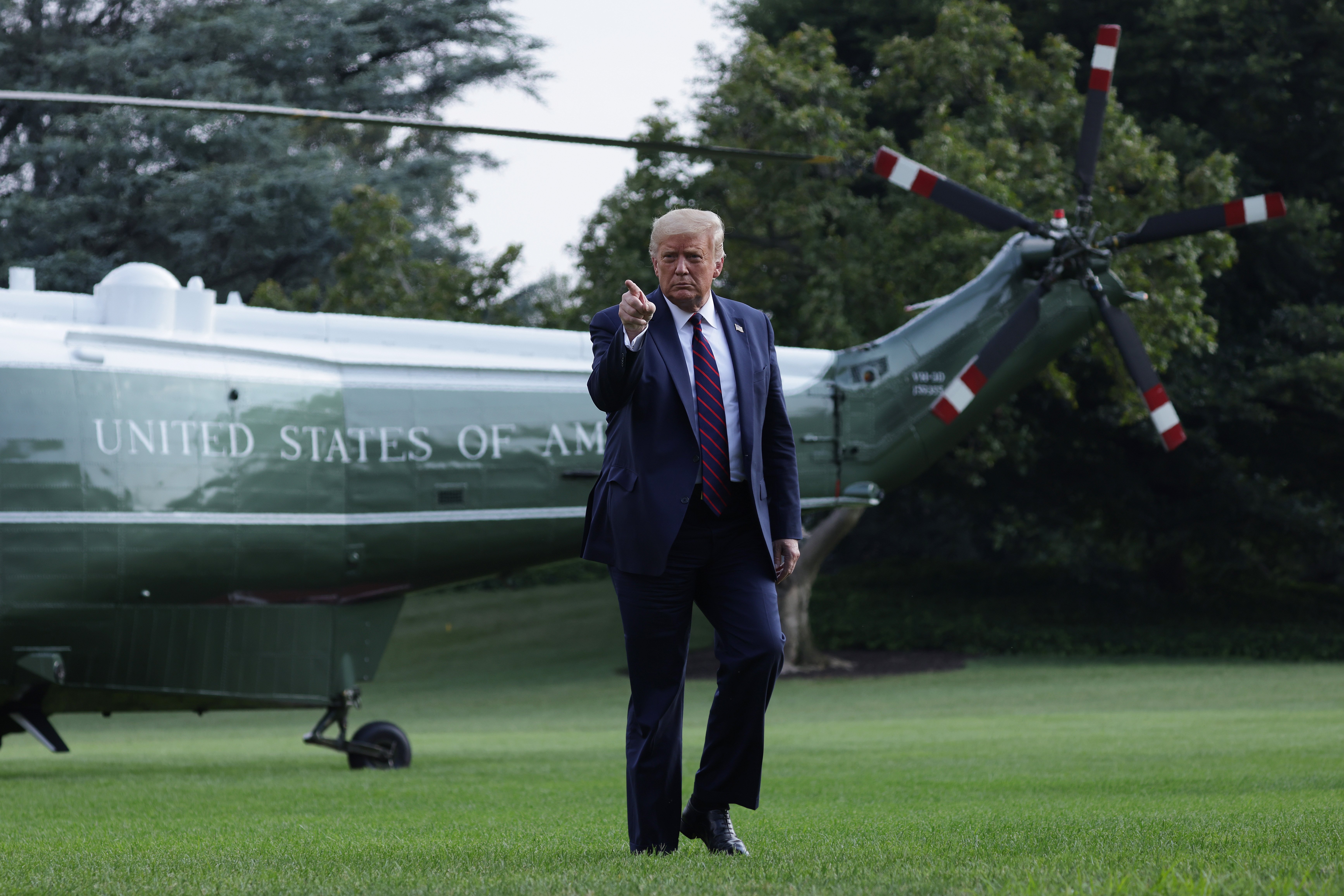 WASHINGTON, DC - JULY 27: U.S. President Donald Trump walks on the South Lawn after he landing aboard Marine One at the White House July 27, 2020 in Washington, DC. Trump was returning from a visit to the FUJIFILM Diosynth Biotechnologies' Innovation Center in Morrisville, North Carolina, a facility that supports manufacturing of "key components of the COVID-19 vaccine candidate" developed by Novavax. (Photo by Alex Wong/Getty Images)