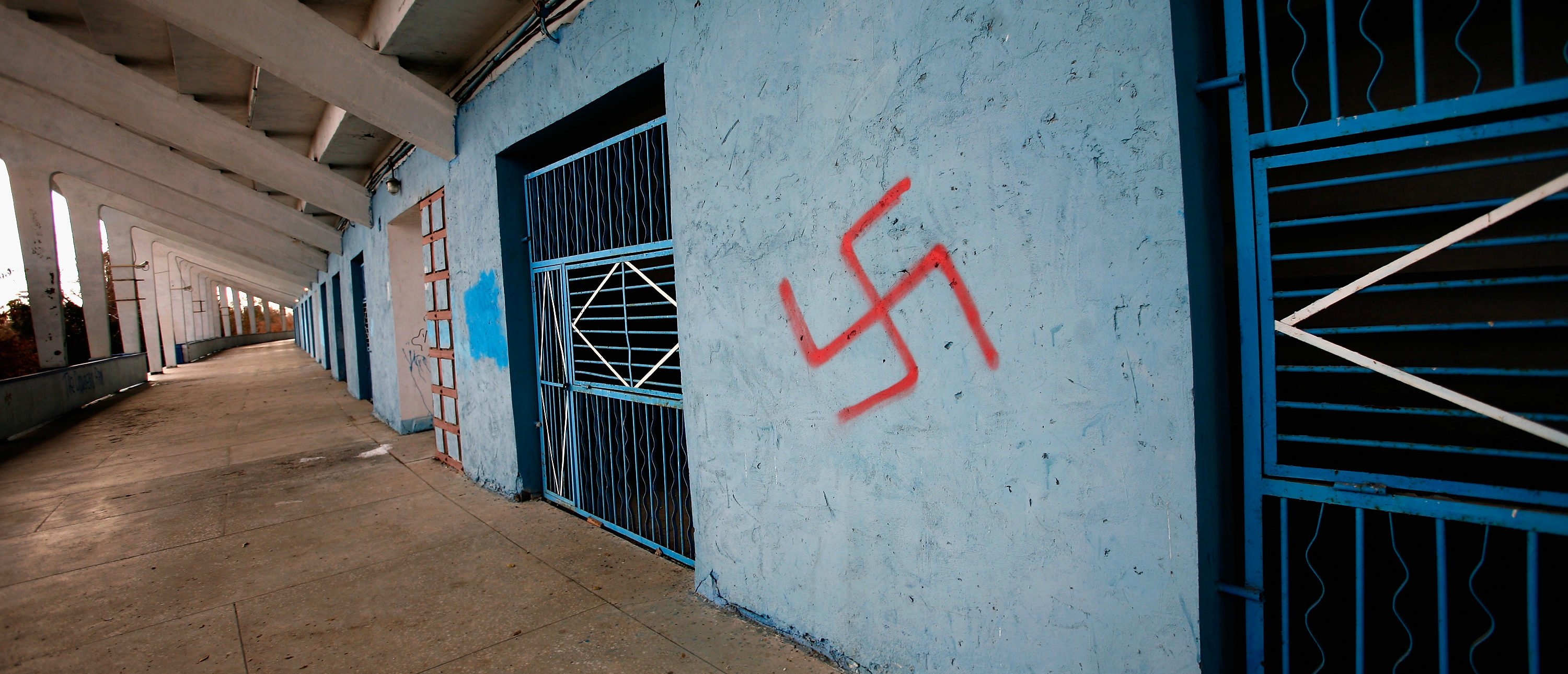 A swastika is seen graffitied on a wall in the Volgograd football stadium on November 16, 2011 in Volgograd, Russia. The stadium is due to be overhauled before the World Cup but work has yet to begin. Volgograd is one of thirteen proposed host cities as Russia prepares to host the 2018 FIFA World Cup. (Photo by Harry Engels/Getty Images)