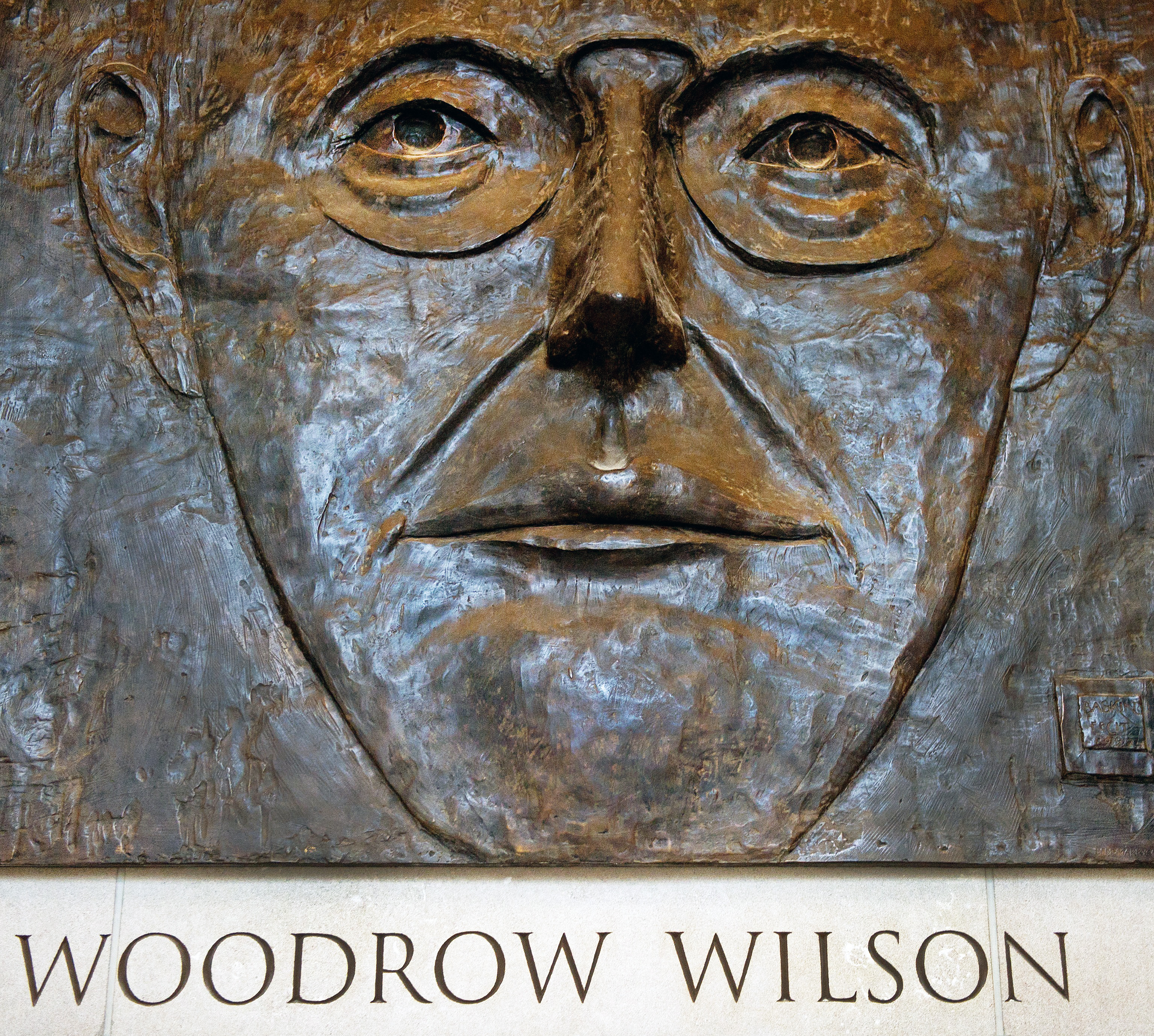 A three -dimentional Congressionally-authorized memorial bas relief of former US President Woodrow Wilson by artist Leonard Baskin is seen hanging on the wall December 6, 2011, at the Woodrow Wilson International Center for Scholars in Washington, DC.( PAUL J. RICHARDS/AFP via Getty Images)