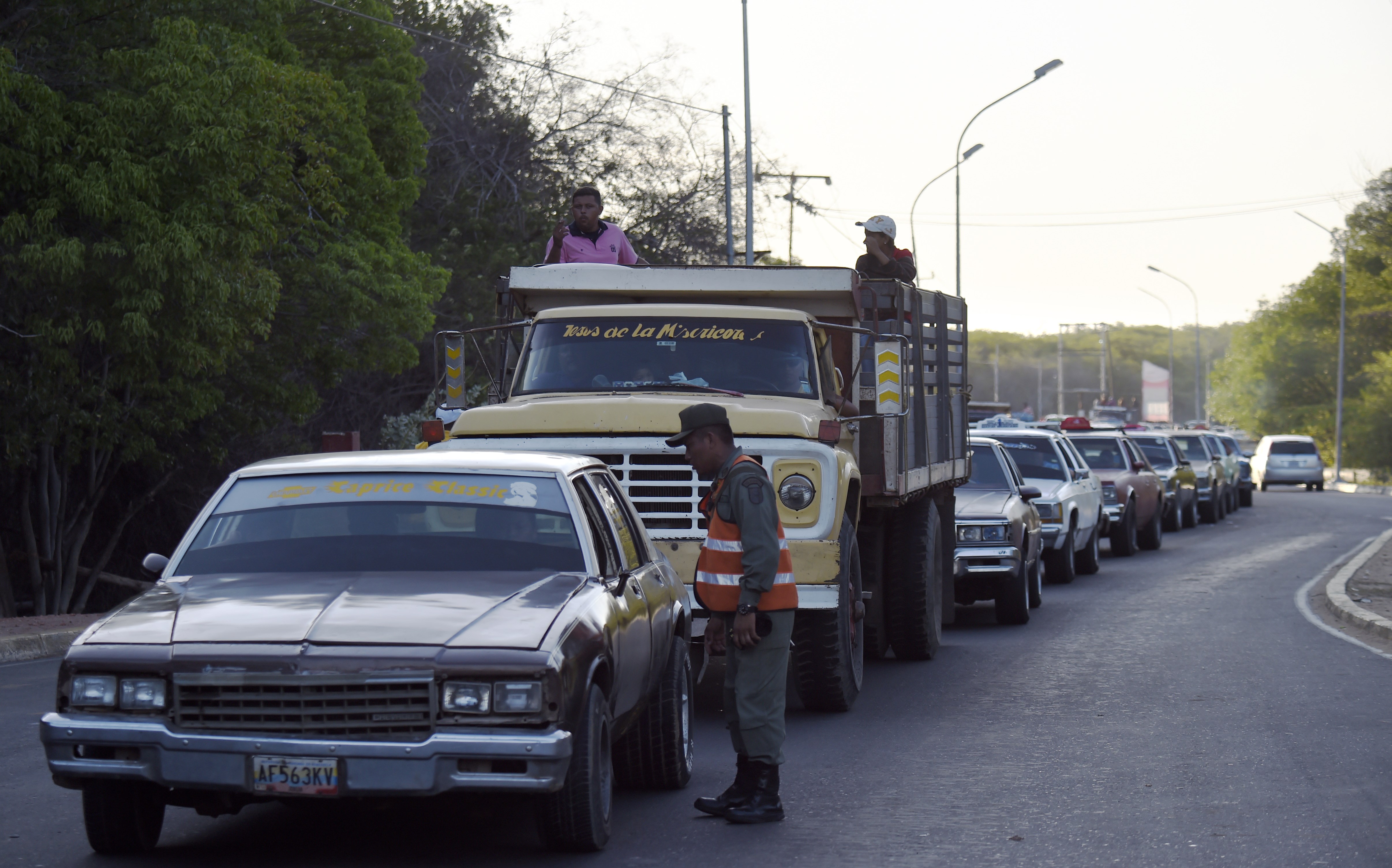 Members of the Venezuelan national guard are pictured at a checkpoint in the municipality of Limon, Zulia State, Venezuela, in the border with Colombia, on Sept. 10, 2015. On Aug. 19 Venezuela President Nicolas Maduro closed part of the border with Colombia and ordered the expulsion of some 1,500 Colombians living in Venezuela. Another 18,500 have fled, the United Nations said earlier this week. (JUAN BARRETO/AFP via Getty Images)