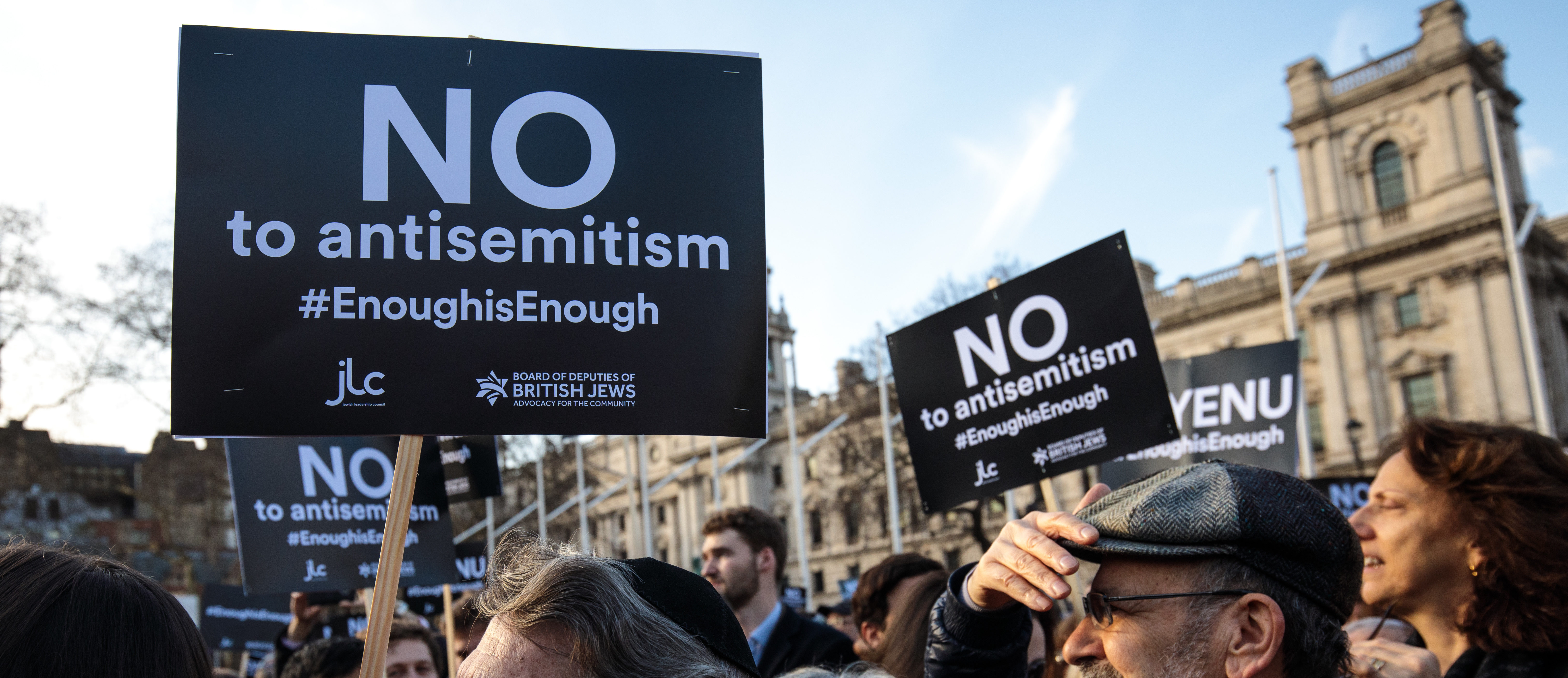 LONDON, ENGLAND - MARCH 26: Protesters hold placards as they demonstrate in Parliament Square against anti-Semitism on March 26, 2018 in London, England. The Board of Deputies of British Jews and the Jewish Leadership Council have drawn up a letter accusing Labour Leader Jeremy Corbyn of failing to address anti-Semitism in his party. Mr Corbyn has today apologised to Jewish groups for "pockets of anti-Semitism" in Labour. (Photo by Jack Taylor/Getty Images)