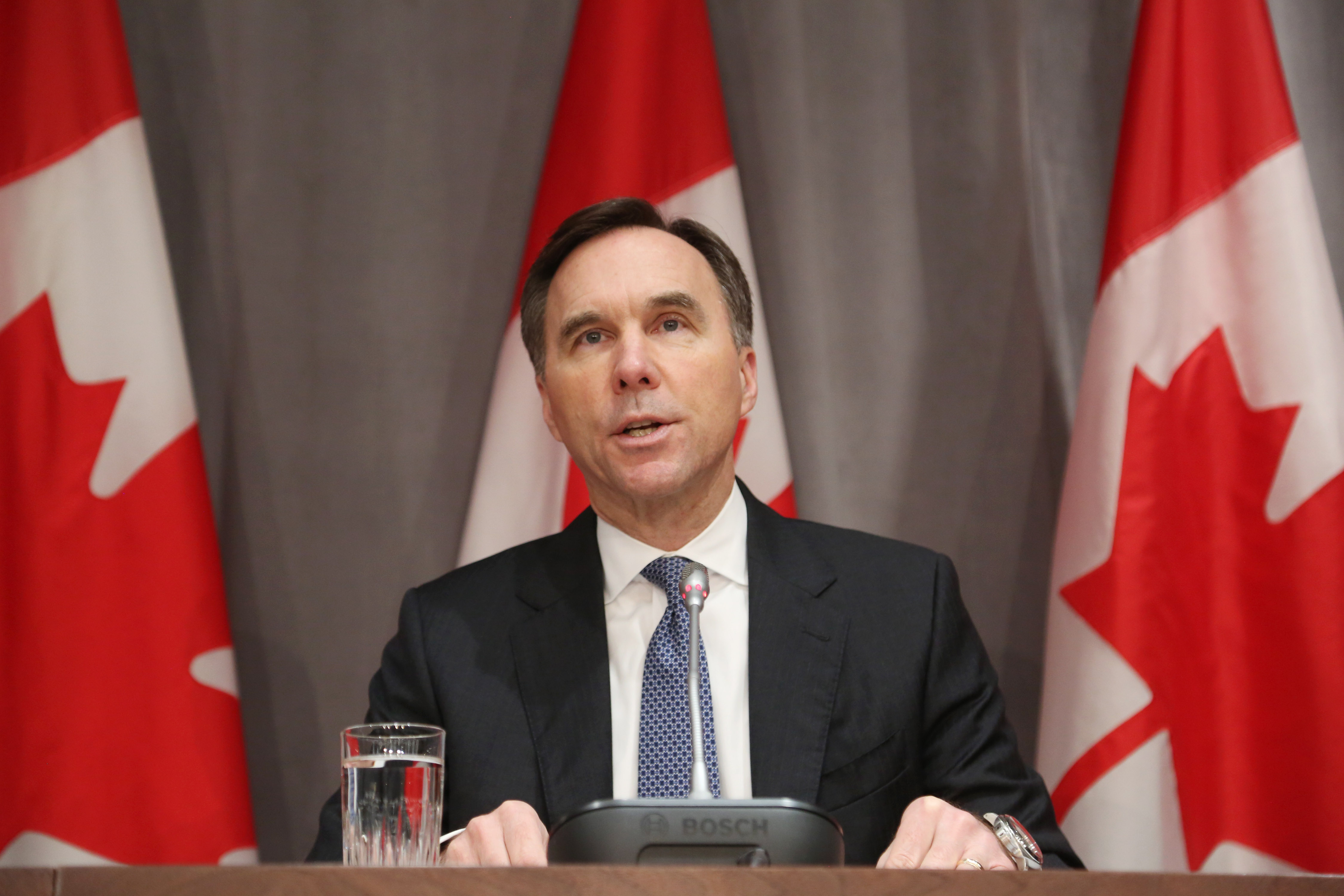 Canada's Finance Minister Bill Morneau speaks during a news conference on Parliament Hill March 18, 2020 in Ottawa, Ontario. - Canadian Prime Minister Justin Trudeau announced Can$27 billion in direct aid on March 18, 2020 to help workers and businesses cope with the economic impacts of the coronavirus pandemic.He said tax payments worth an estimated Can$55 billion could be deferred until August. (Photo by Dave Chan / AFP) (Photo by DAVE CHAN/AFP via Getty Images)
