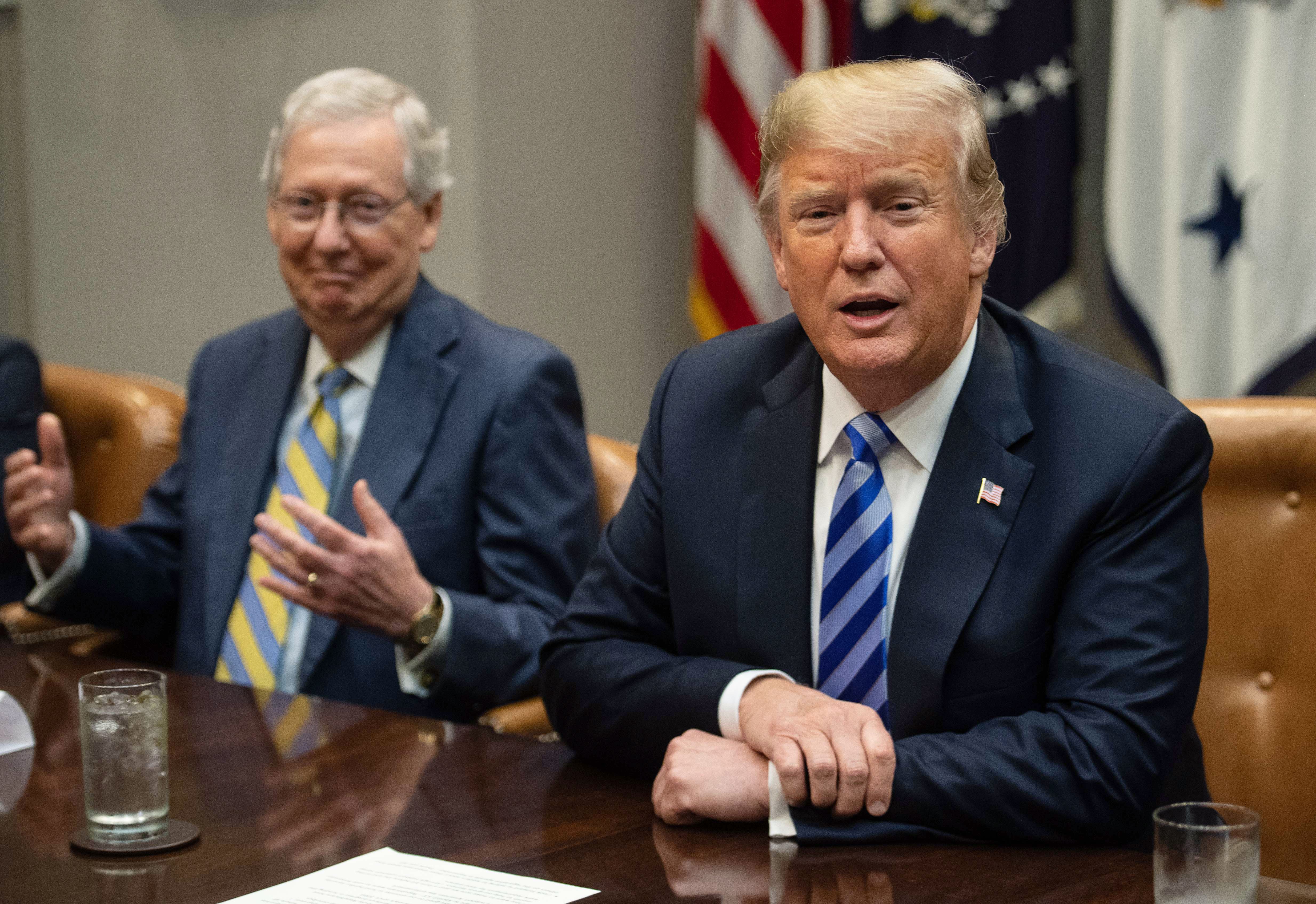 US Senate Majority Leader Mitch McConnell (L) reacts as President Donald Trump speaks to the press before a meeting with Republican Congressional leaders at the White House in Washington, DC, on September 5, 2018. (Photo by NICHOLAS KAMM / AFP) (Photo credit should read NICHOLAS KAMM/AFP via Getty Images)