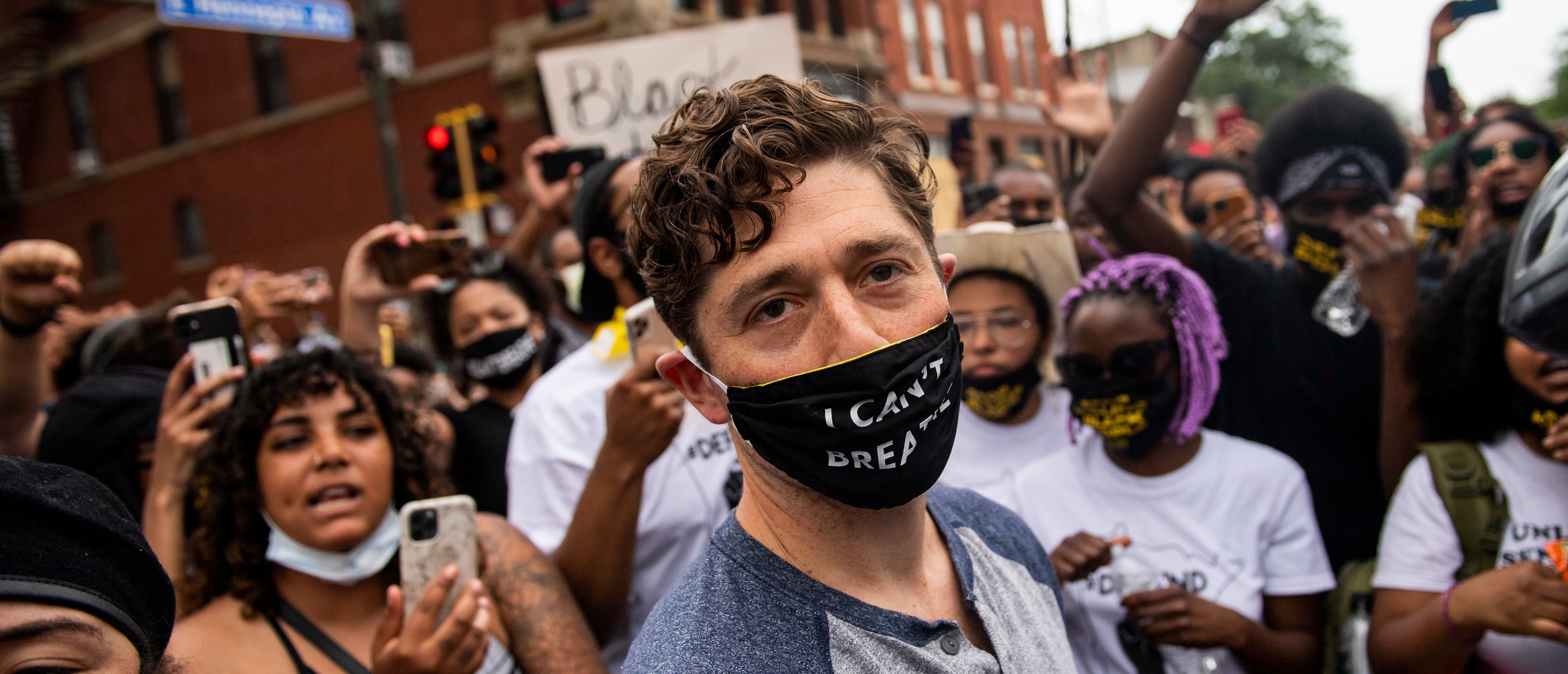 Minneapolis Mayor Jacob Frey leaves after coming out of his home to speak during a demonstration calling for the Minneapolis Police Department to be defunded on June 6, 2020 in Minneapolis, Minnesota. Mayor Frey declined when he was asked if he would fully defund the police and was then asked to leave the protest. (Photo by Stephen Maturen/Getty Images)