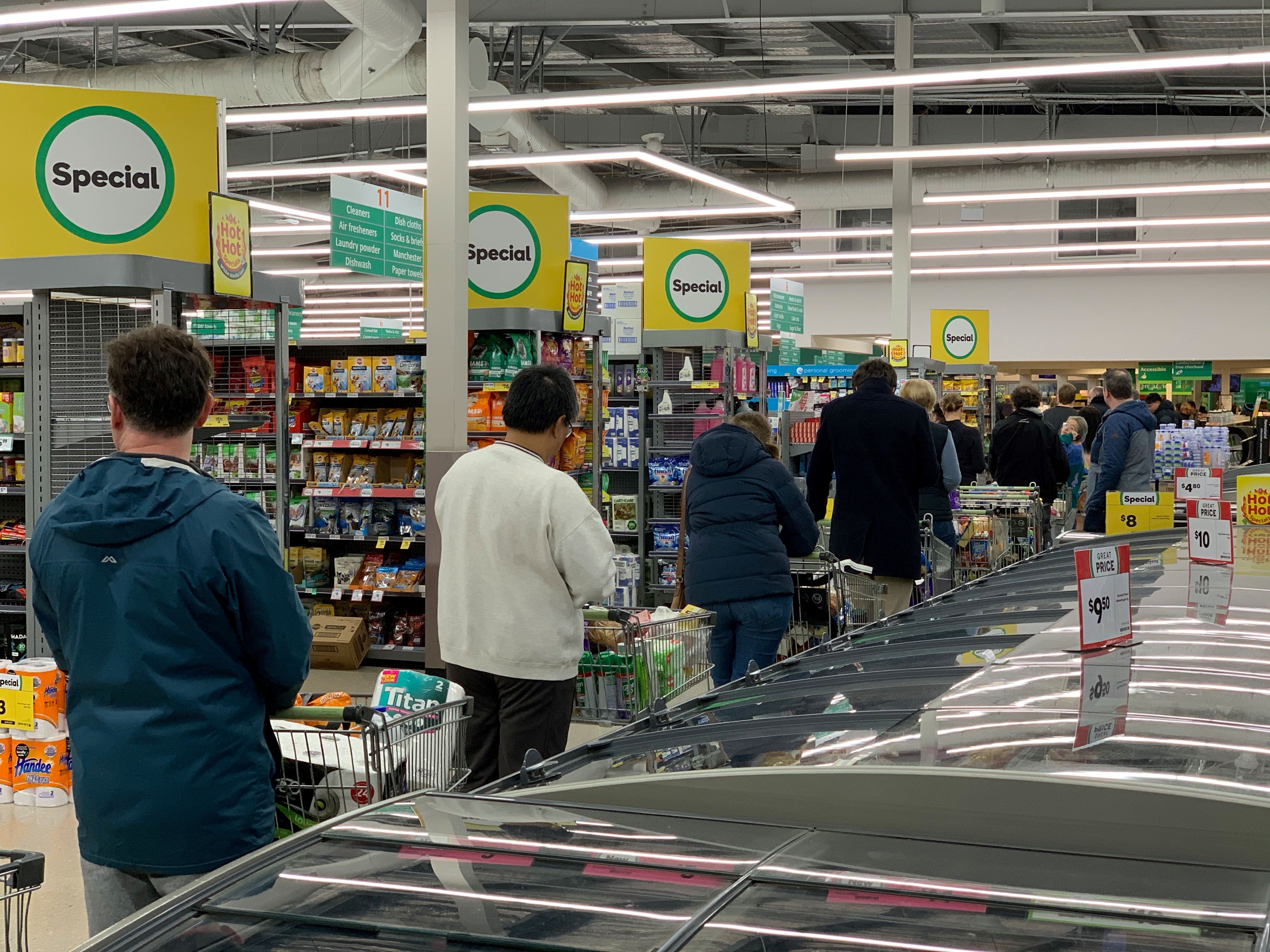 Shoppers shop at a supermarket in the suburb of Johnsonville in Wellington on August 11, 2020. - Auckland has been place at level 3 lockdown and the rest of the country has moved to level 2 after a family in South Auckland tested positive for covid. (Photo by MARTY MELVILLE/AFP via Getty Images)