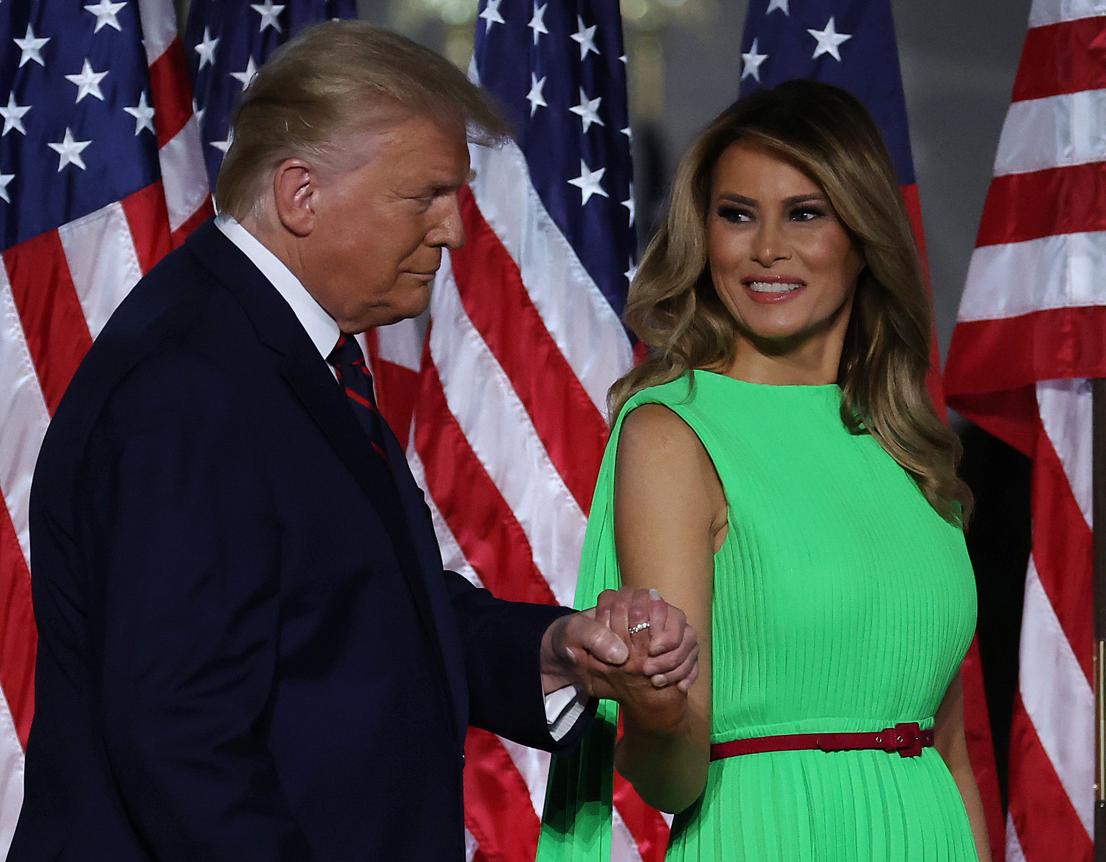 WASHINGTON, DC - AUGUST 27: U.S. President Donald Trump leads first lady Melania Trump off the podium as he prepares to deliver his acceptance speech for the Republican presidential nomination on the South Lawn of the White House August 27, 2020 in Washington, DC. (Photo by Chip Somodevilla/Getty Images)