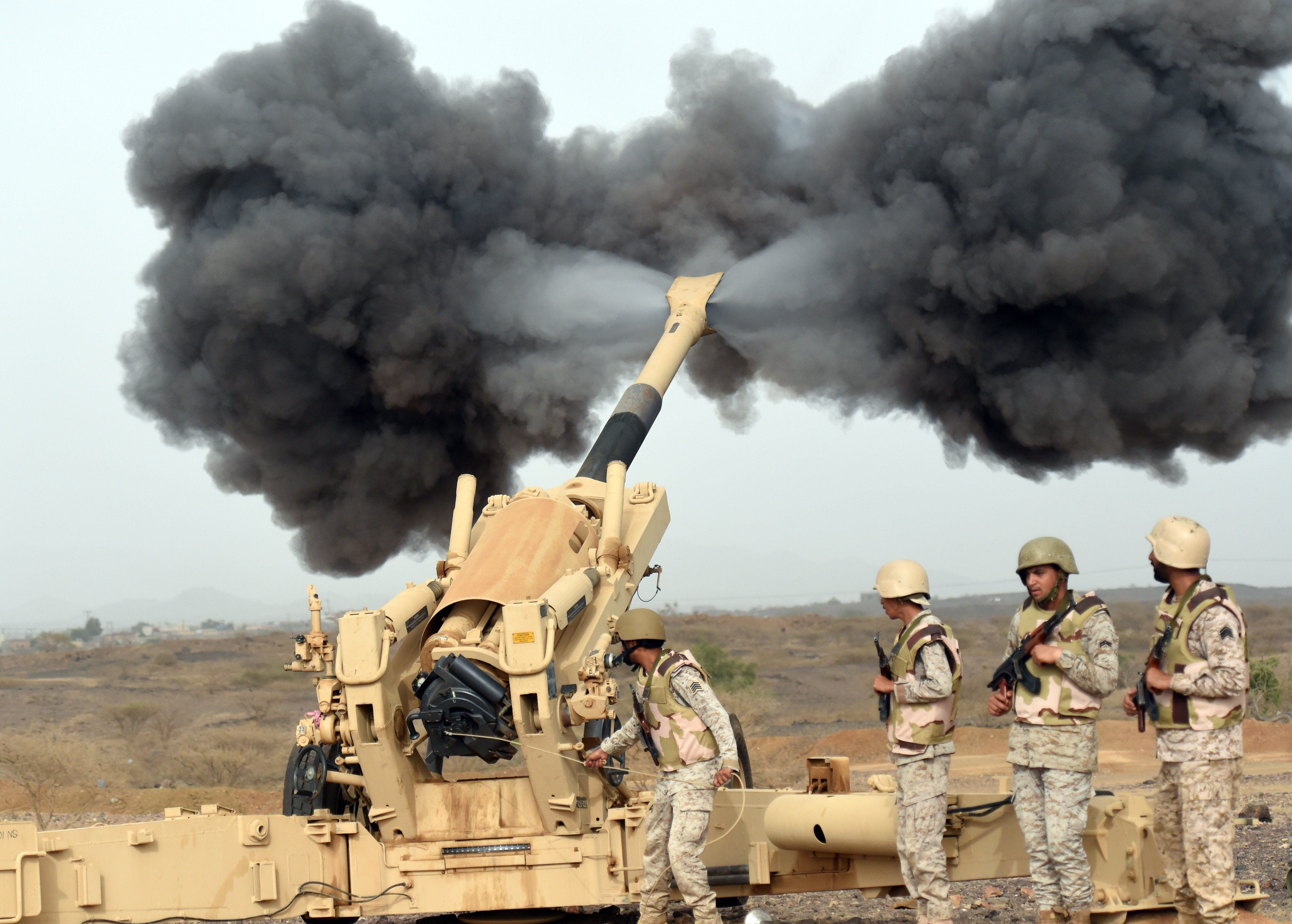 Saudi army artillery fire shells towards Yemen from a post close to the Saudi-Yemeni border, in southwestern Saudi Arabia, on April 13, 2015 . Saudi Arabia is leading a coalition of several Arab countries which since March 26 has carried out air strikes against the Shiite Huthis rebels, who overran the capital Sanaa in September and have expanded to other parts of Yemen. AFP PHOTO / FAYEZ NURELDINE (Photo credit should read FAYEZ NURELDINE/AFP via Getty Images)